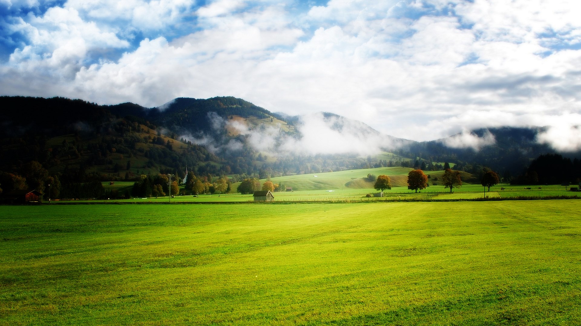 Green Meadow with Mountains and Clouds HD Wallpaper
