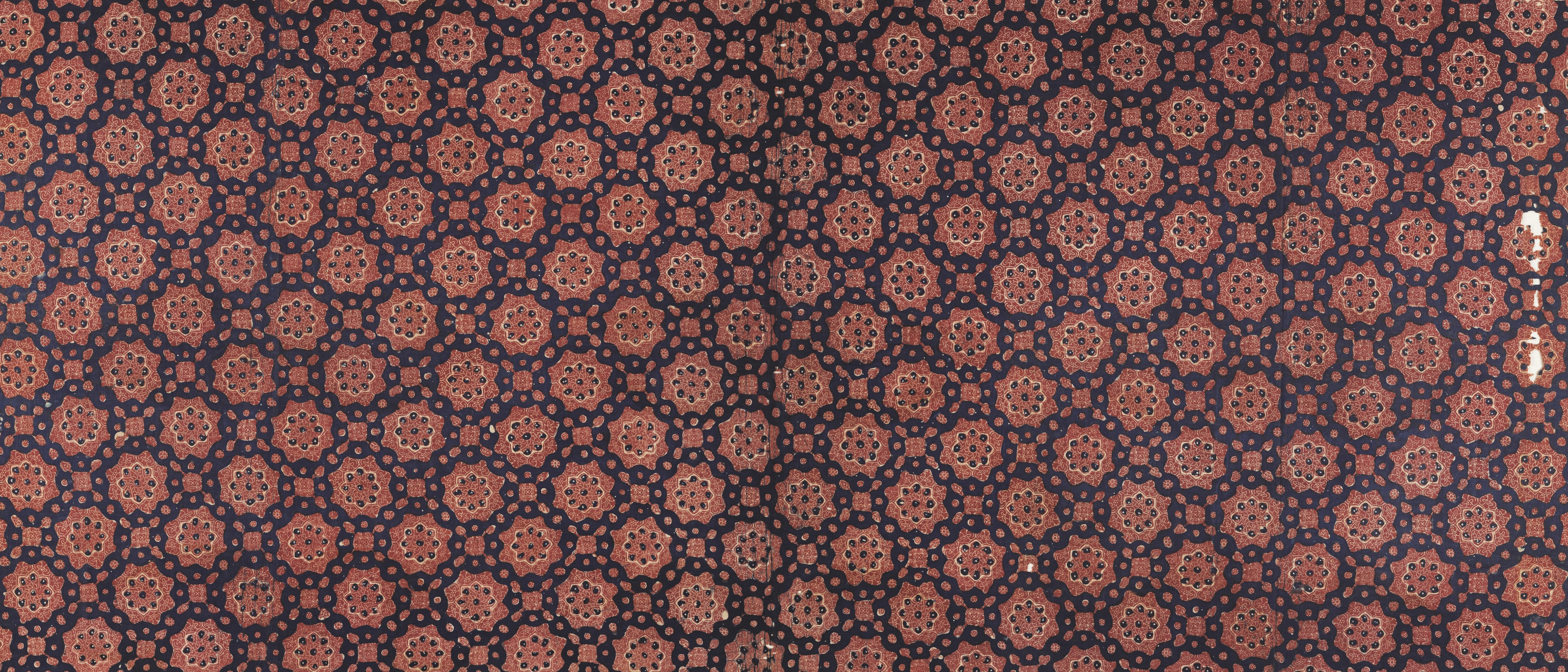 Dark blue fabric with repeating floral geometric pattern HD Wallpaper