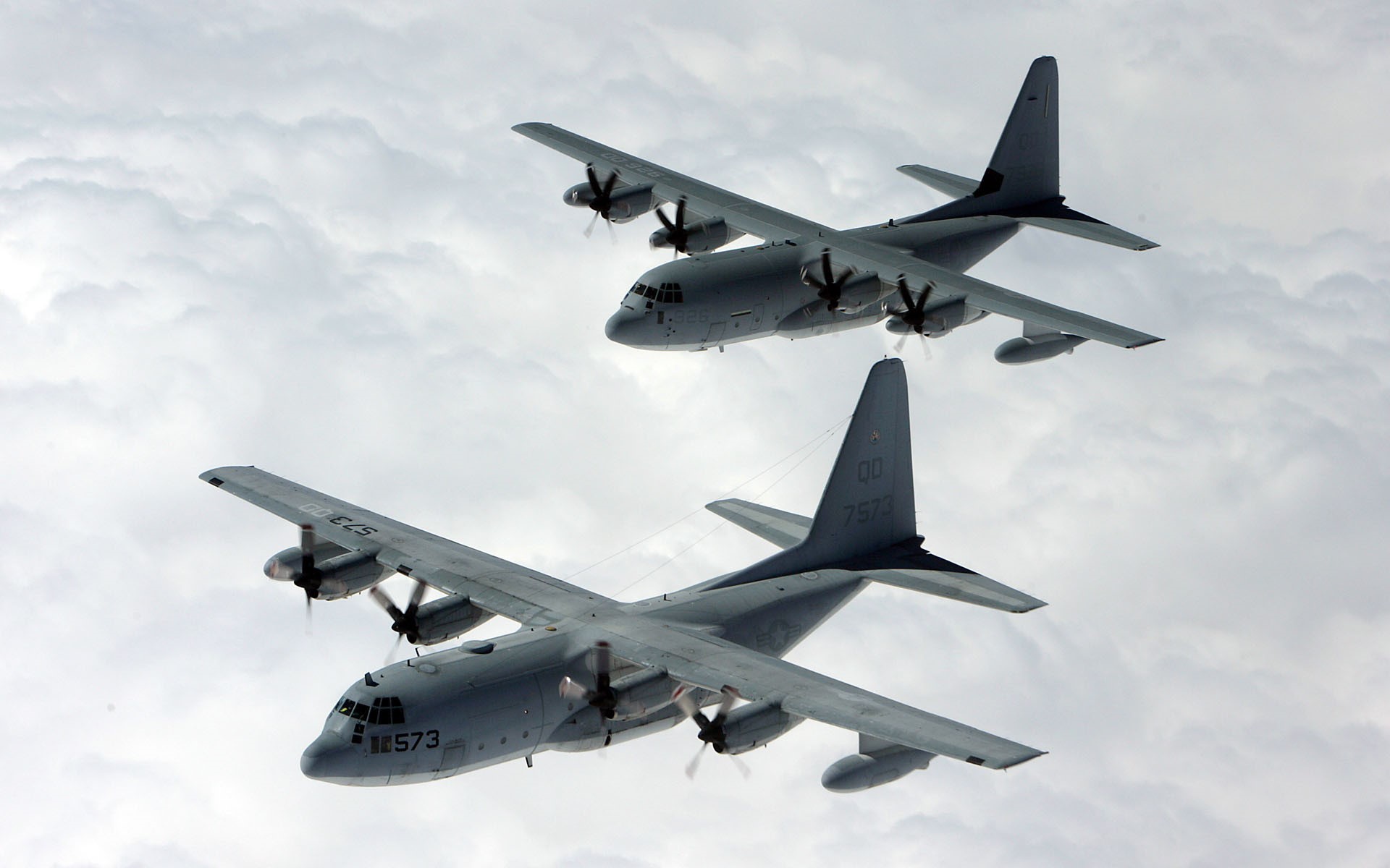Two Lockheed C-130 Hercules aircraft in flight HD Wallpaper