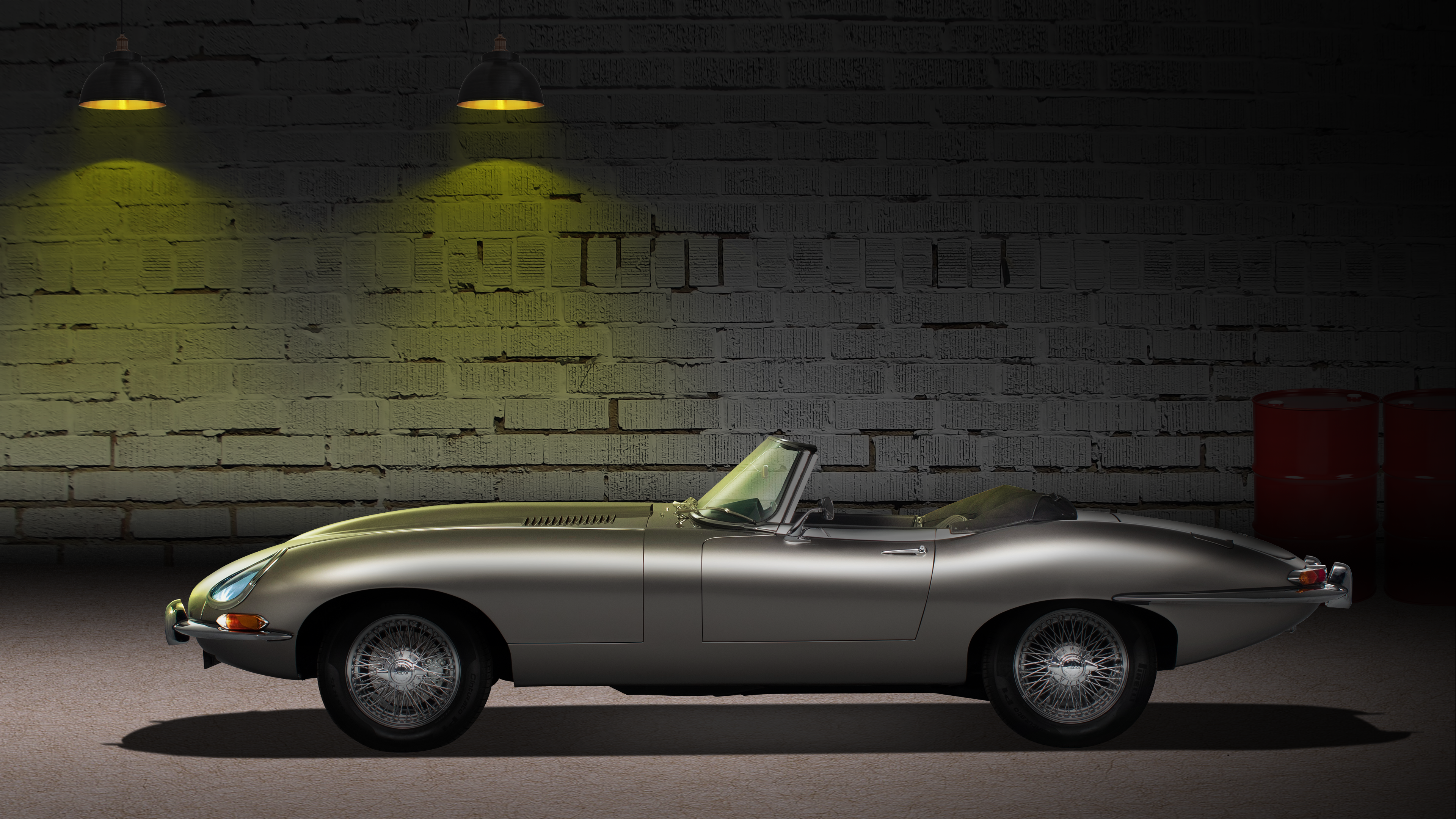 Silver Jaguar E-Type convertible in a garage HD Wallpaper