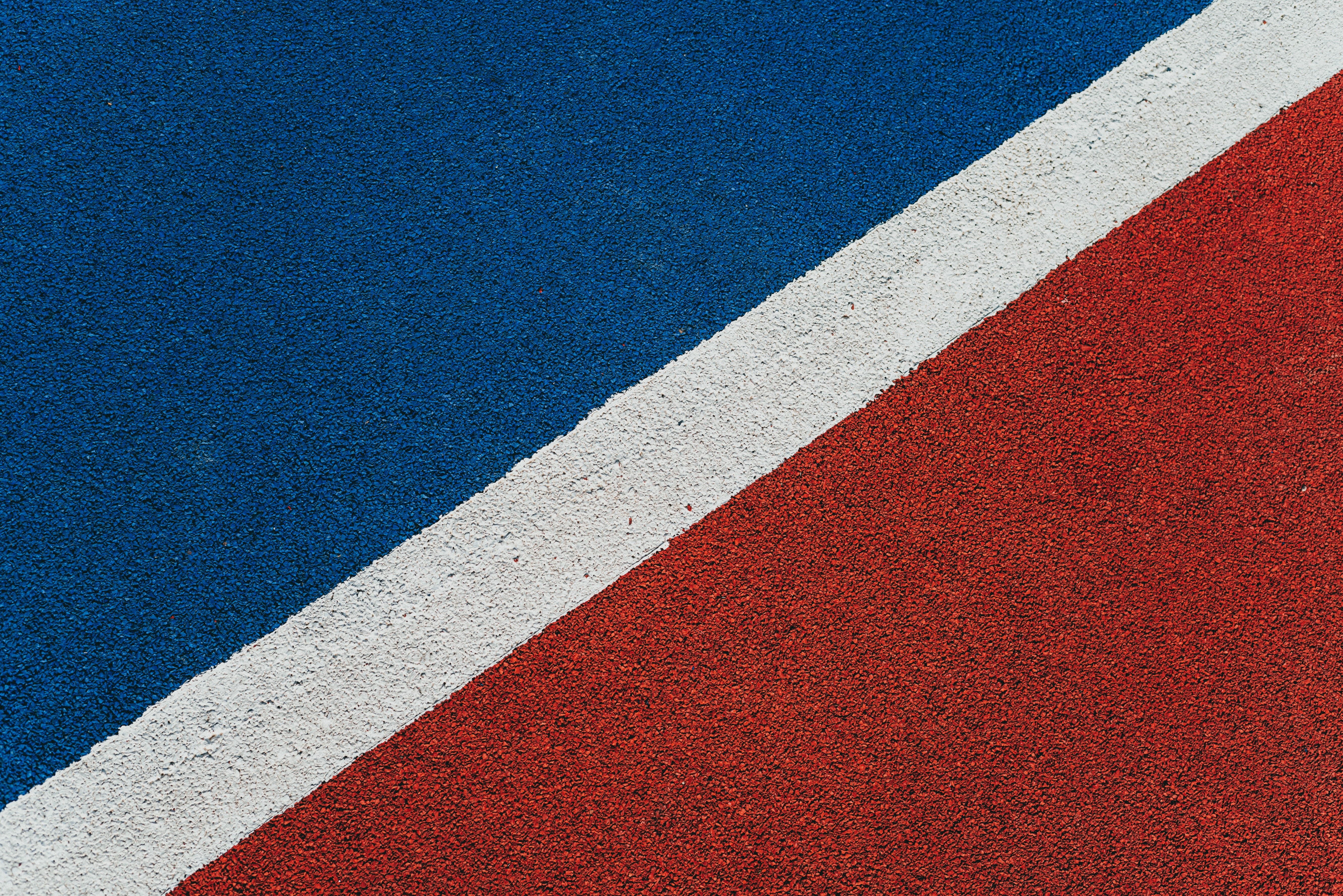 Blue, Red, and White Textured Surface with Diagonal Line HD Wallpaper
