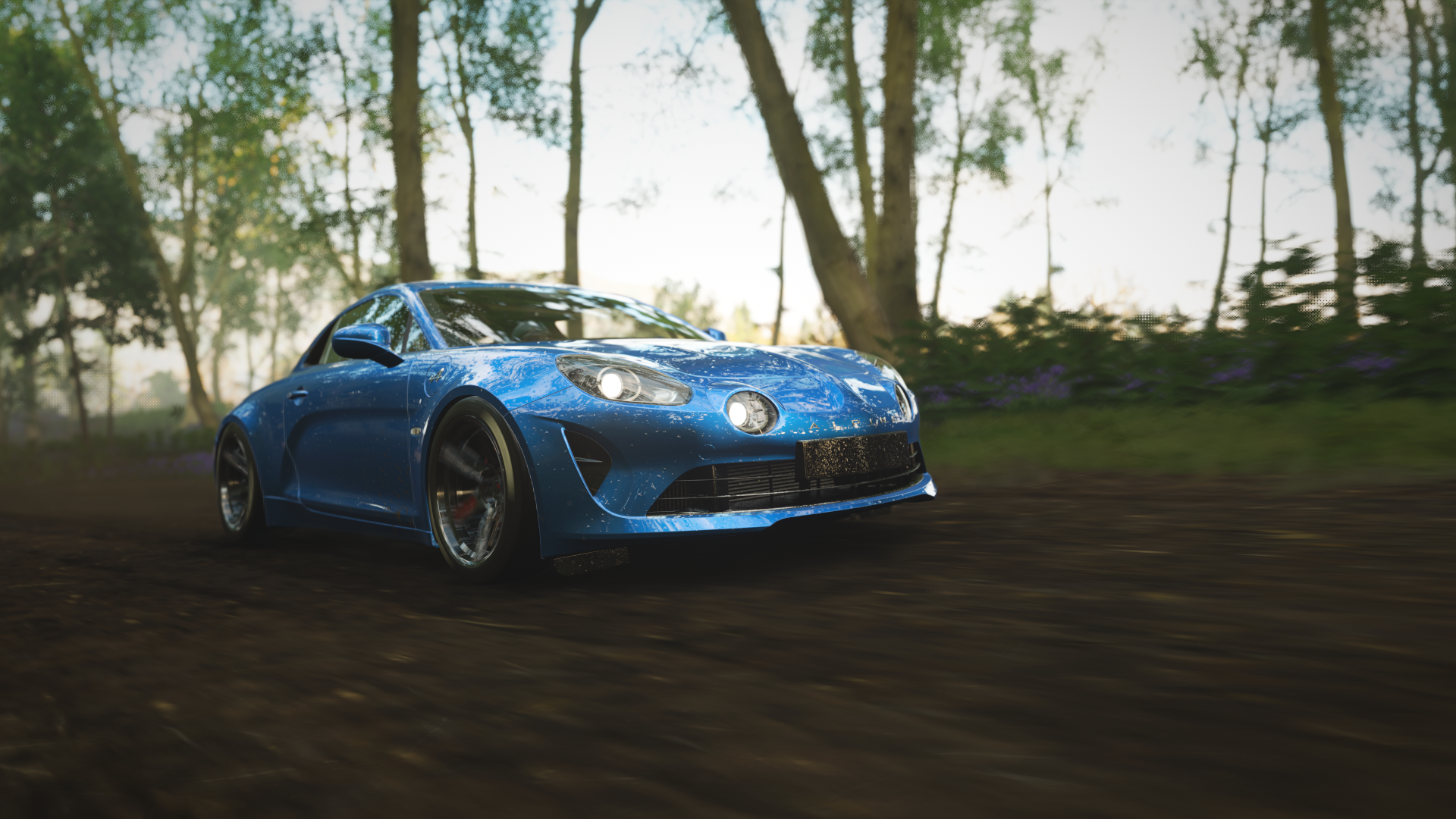 Blue Renault Alpine driving on a dirt road in Forza Horizon 4 HD Wallpaper