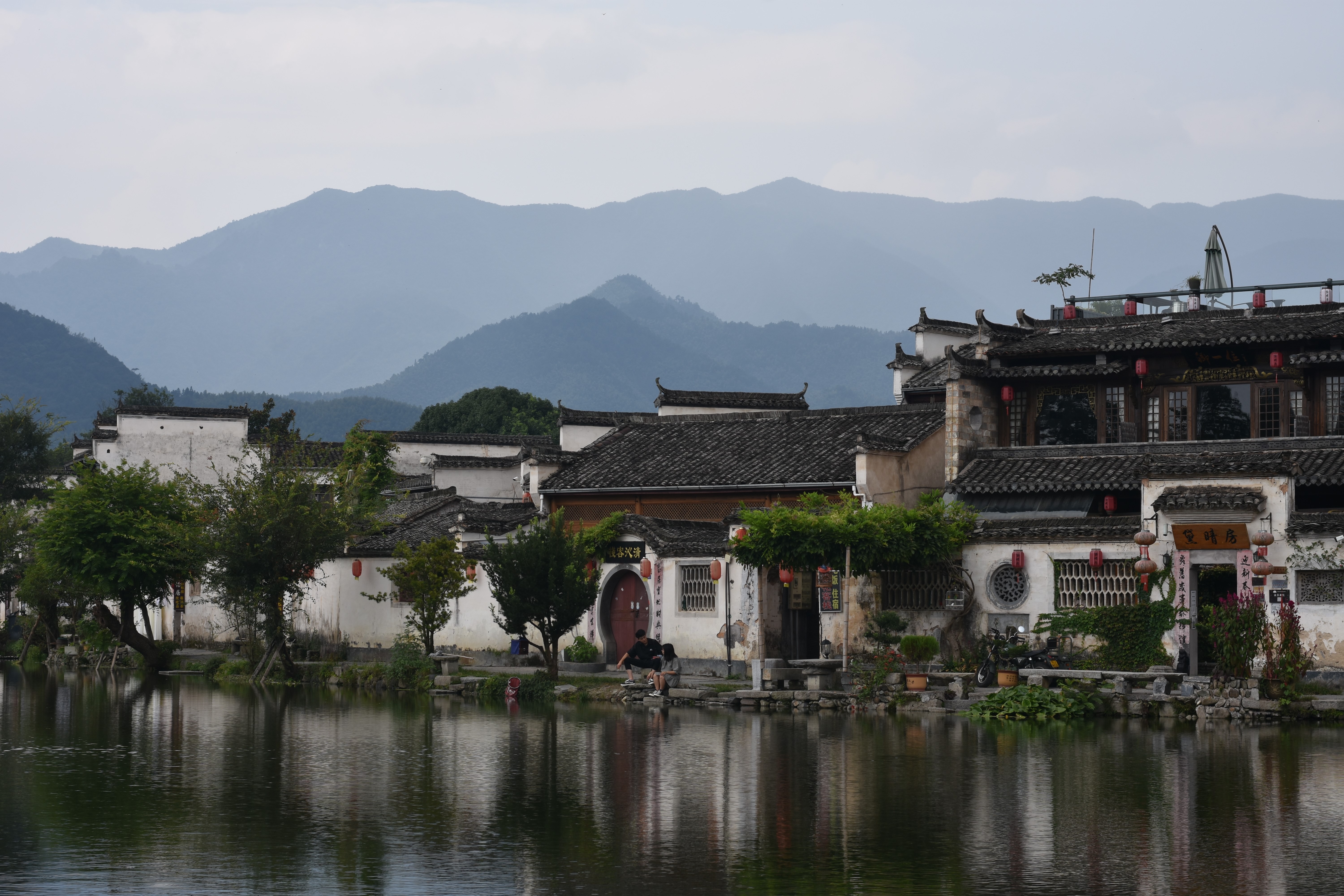 Traditional Chinese village with mountains and water HD Wallpaper