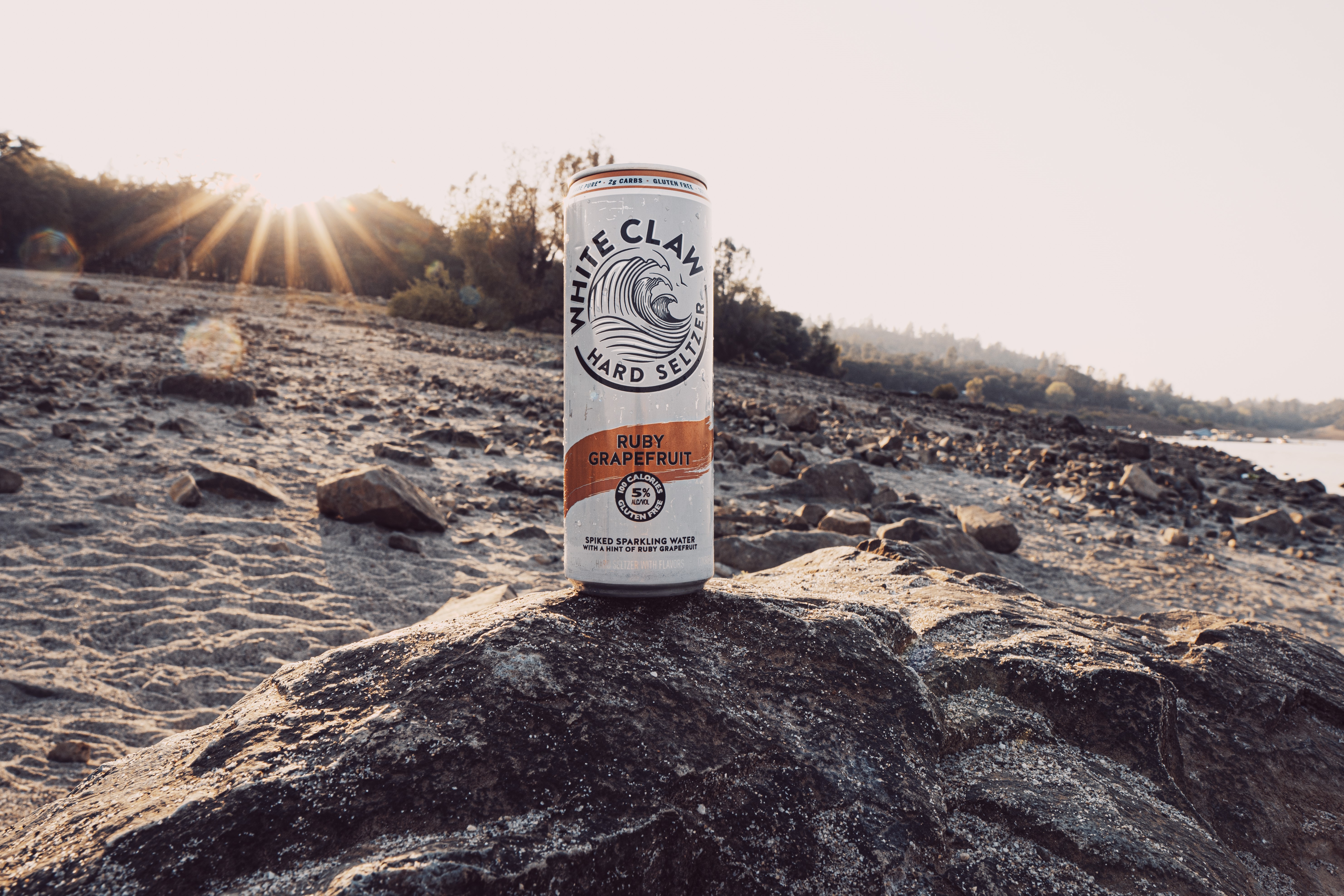 White Claw Hard Seltzer Ruby Grapefruit can at Collins Lake HD Wallpaper
