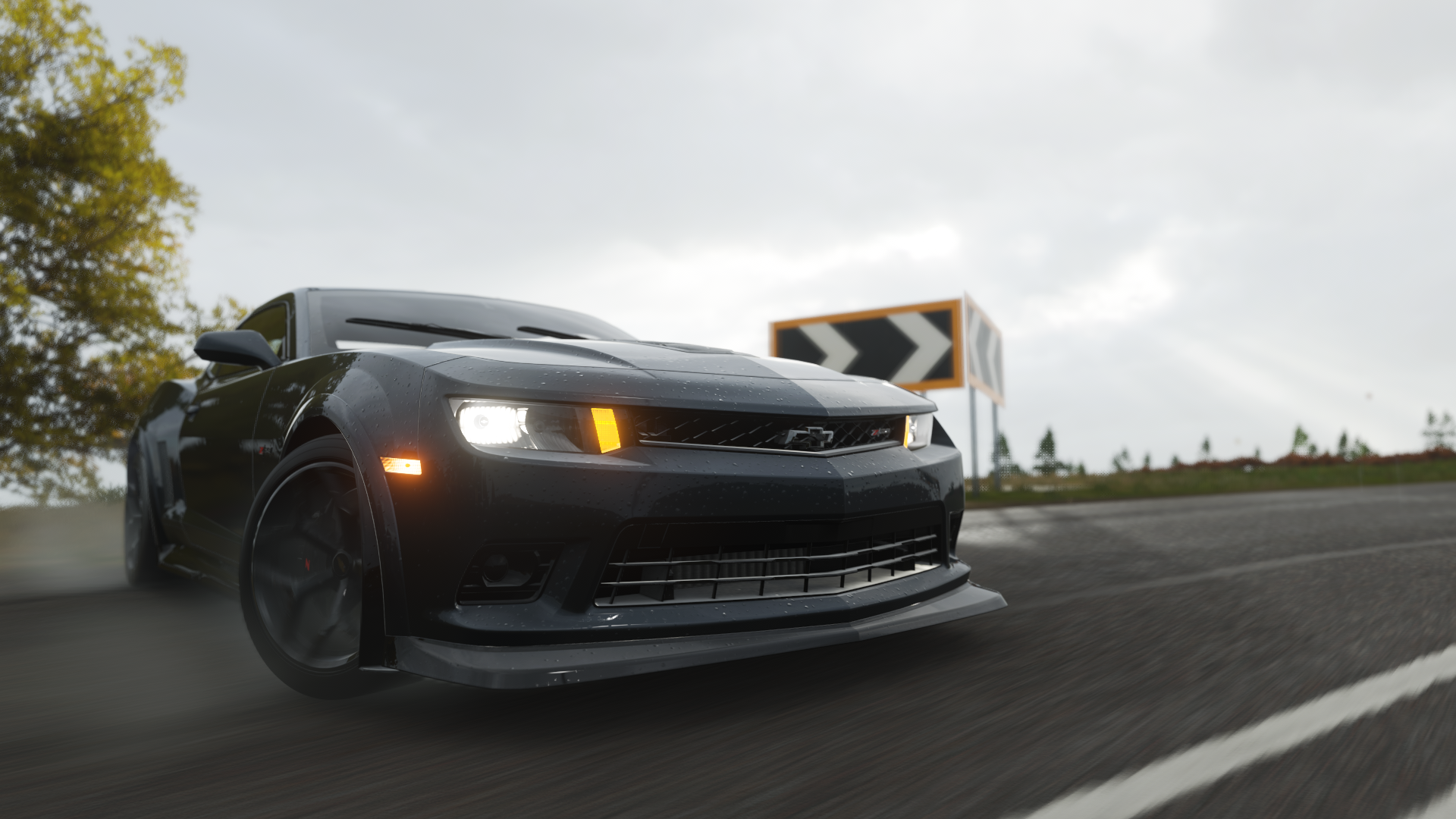 Black Chevrolet Camaro driving on a wet road HD Wallpaper