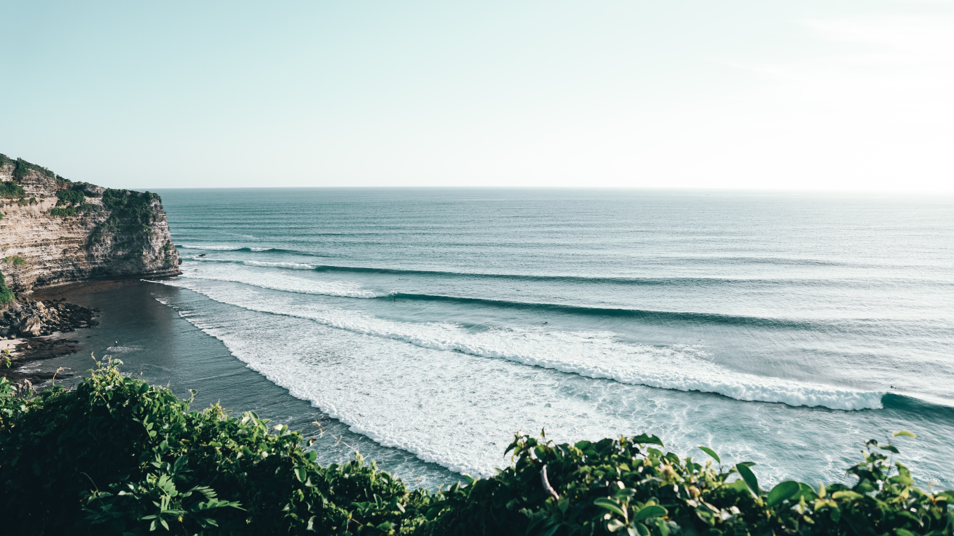 Waves crashing on a cliffside coast in Bali, Indonesia HD Wallpaper
