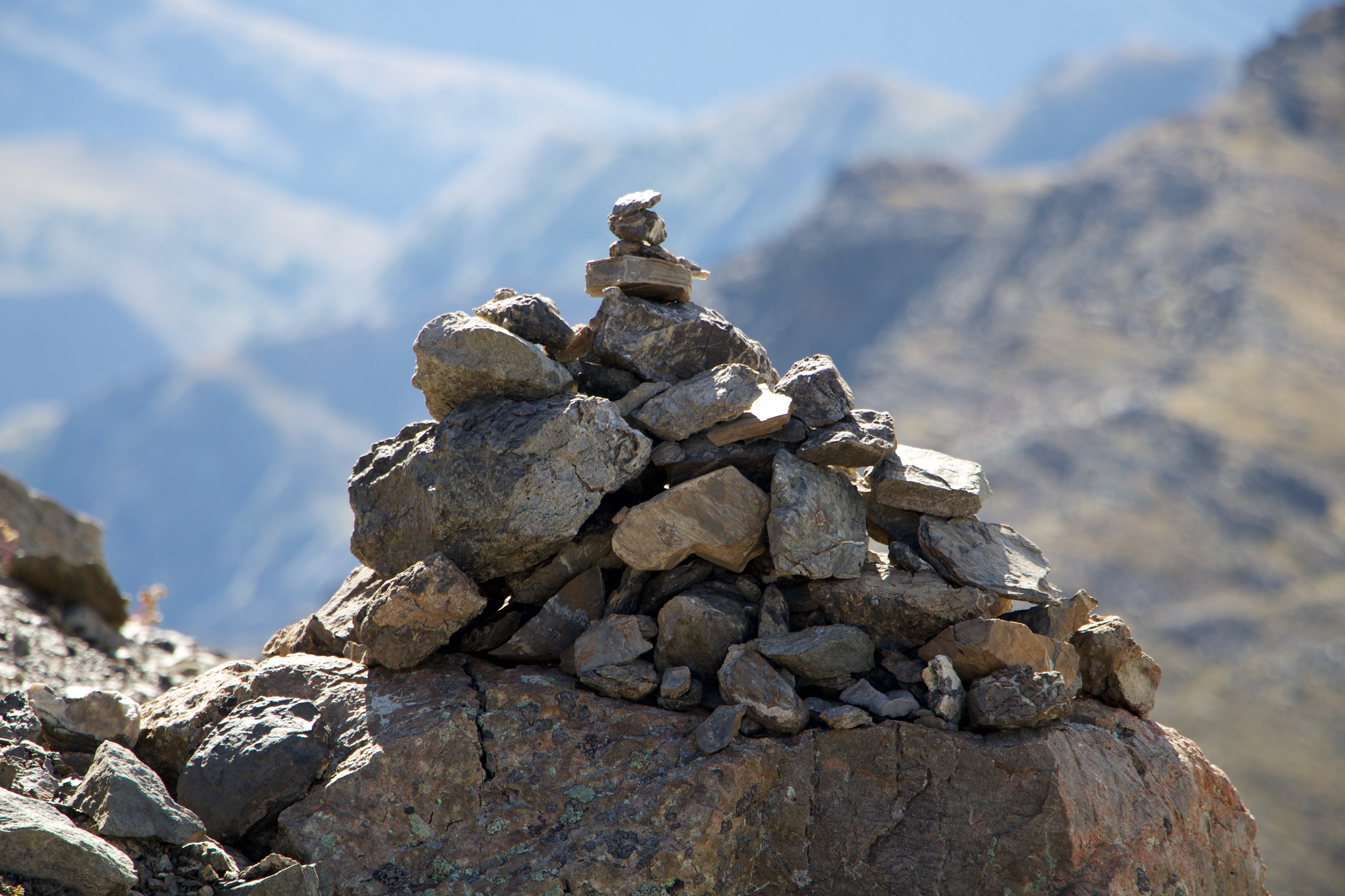 Cairns on a rocky mountain peak HD Wallpaper