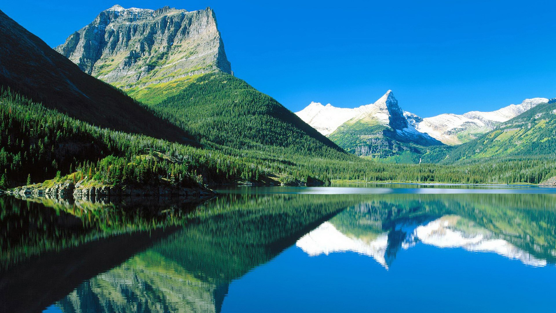 Mountain lake reflection with snow-capped peaks HD Wallpaper