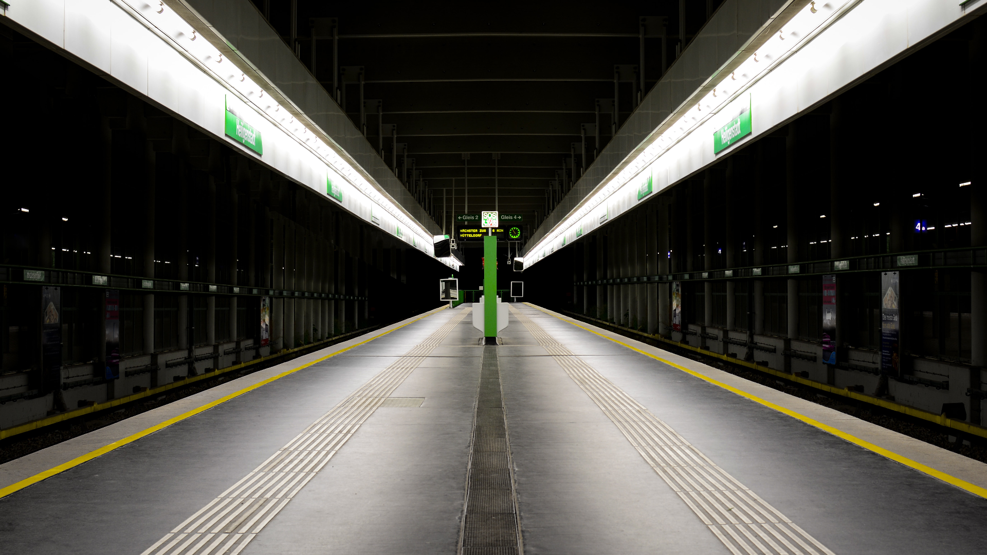 Empty subway platform in Vienna with green signs HD Wallpaper