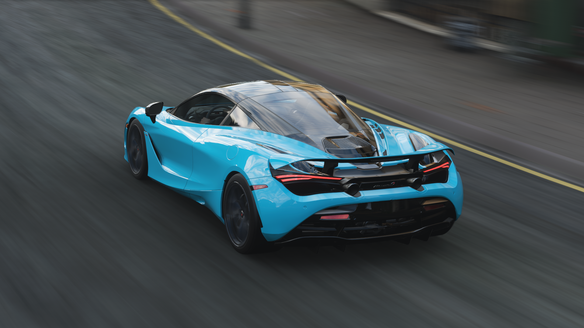 Blue McLaren 720S driving on a road HD Wallpaper