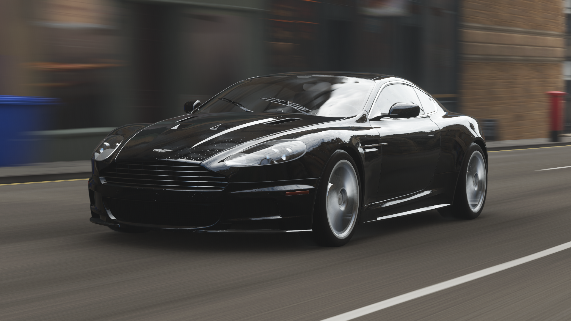 Black Aston Martin DBS driving on a street HD Wallpaper