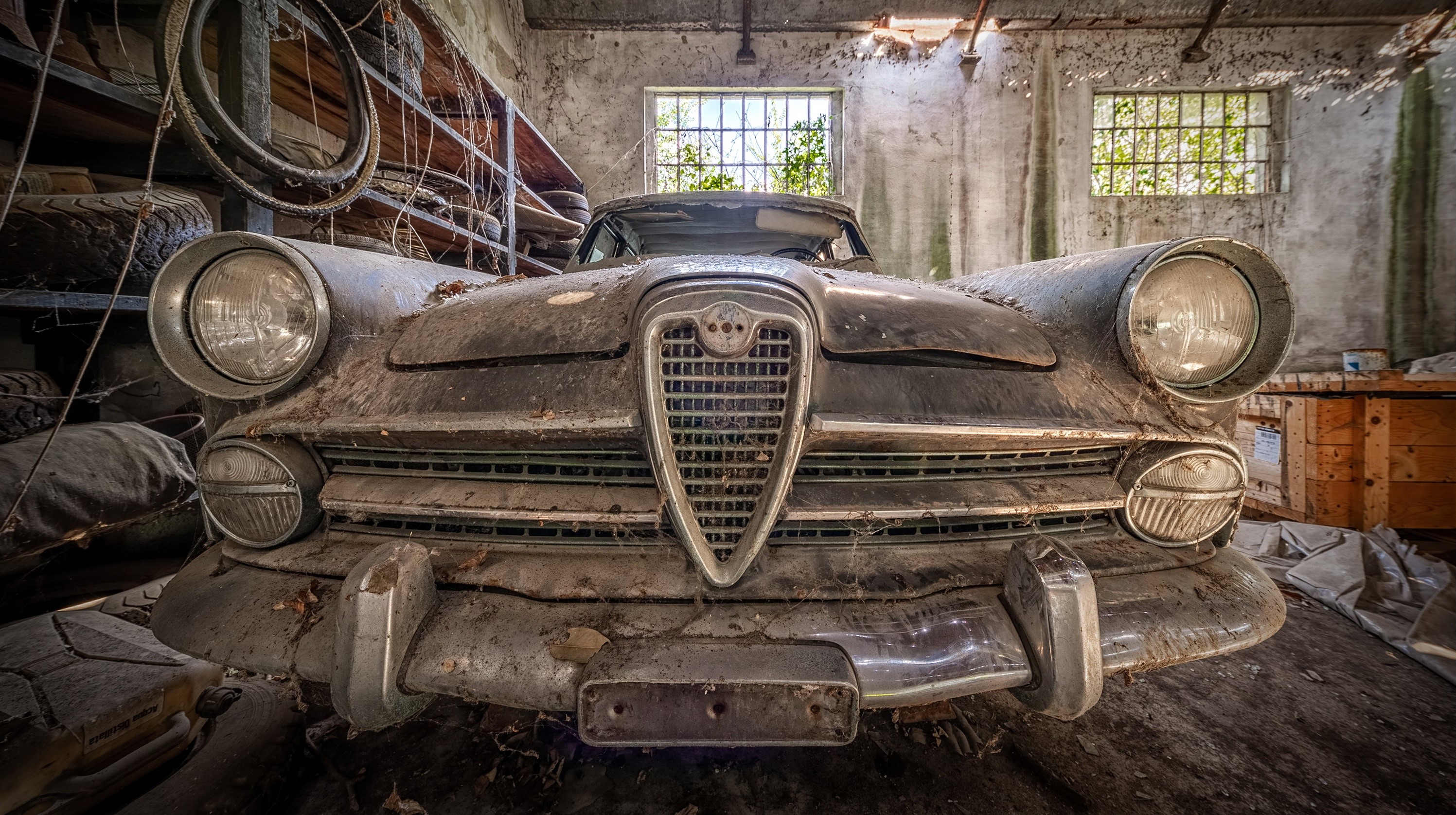 Abandoned Alfa Romeo car in a dusty garage HD Wallpaper