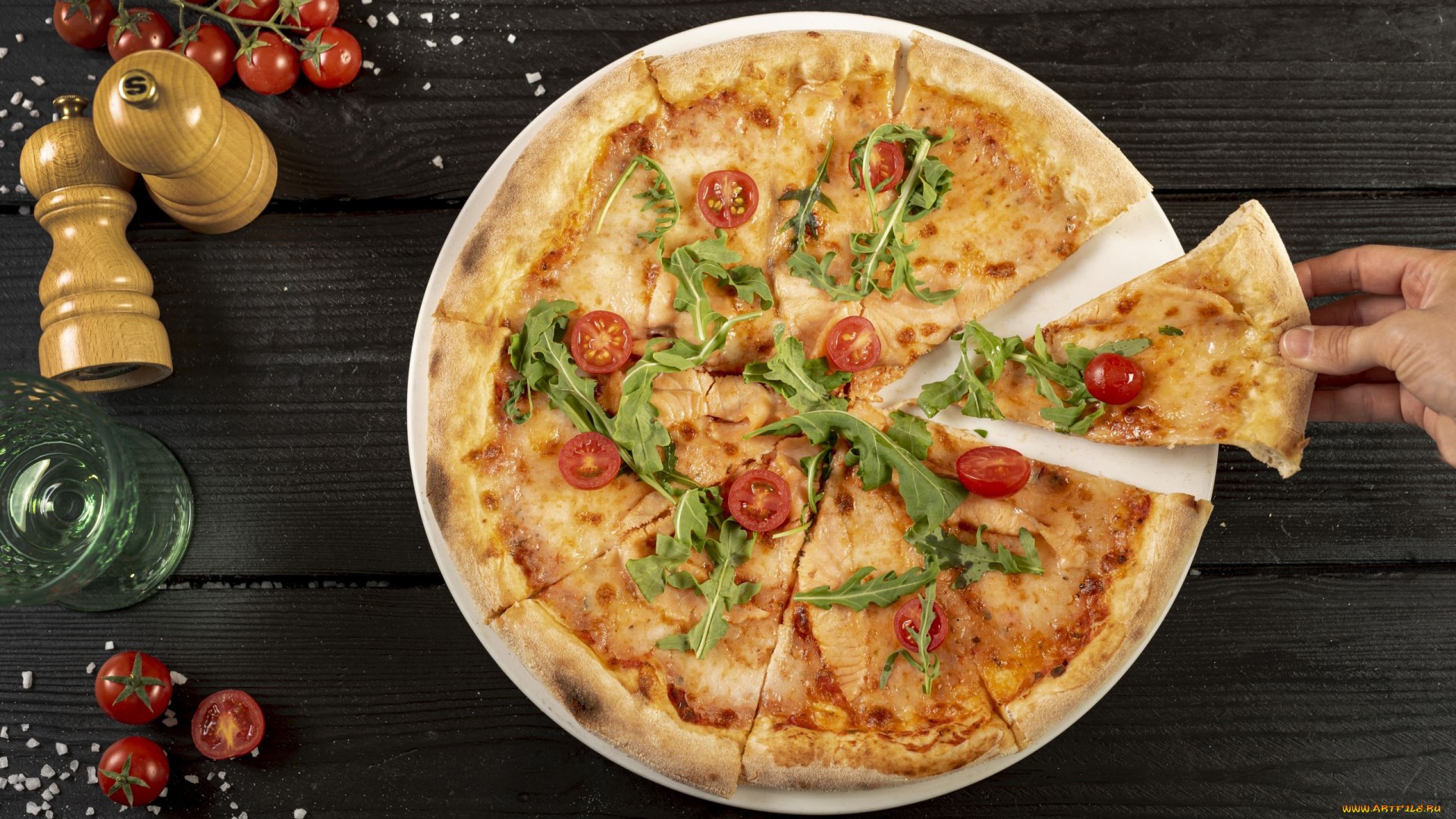 Pizza with tomatoes and arugula on a wooden table HD Wallpaper