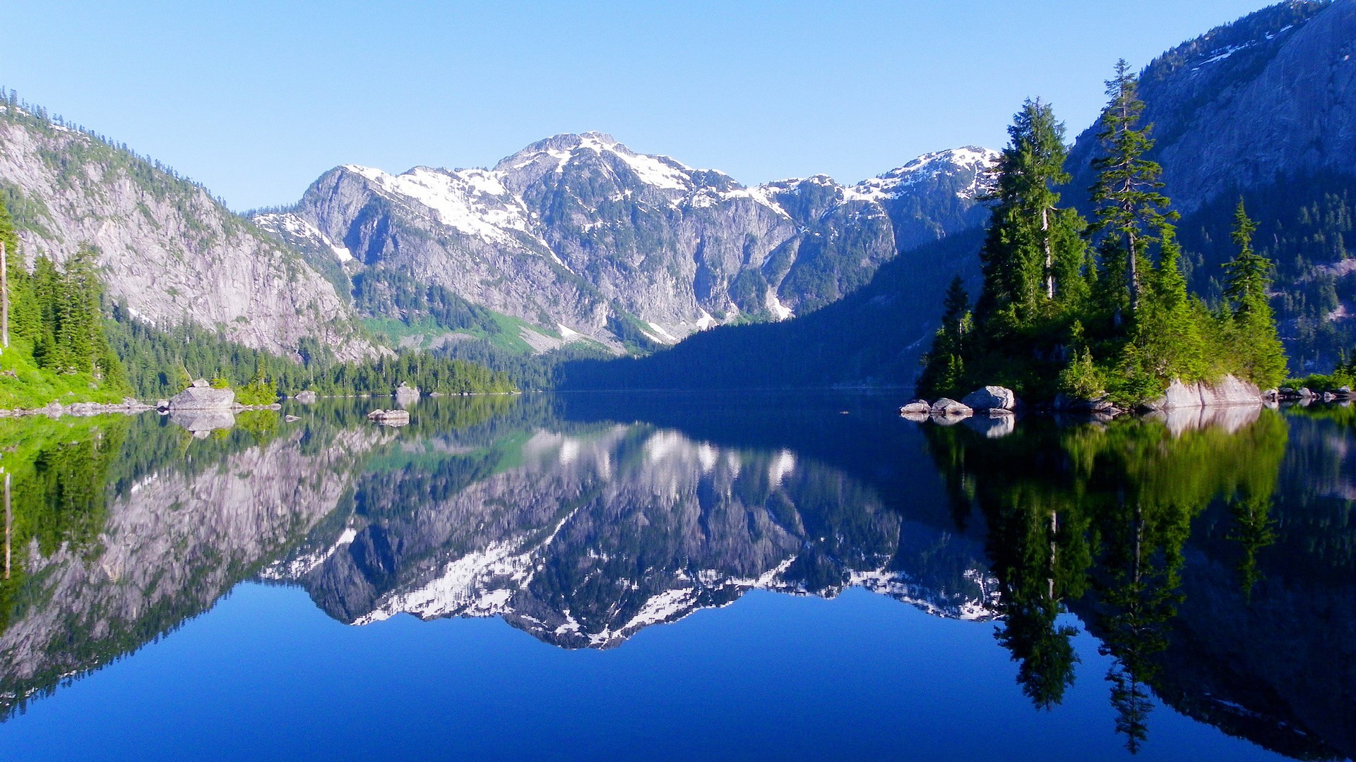 Mountain lake with reflections and island HD Wallpaper