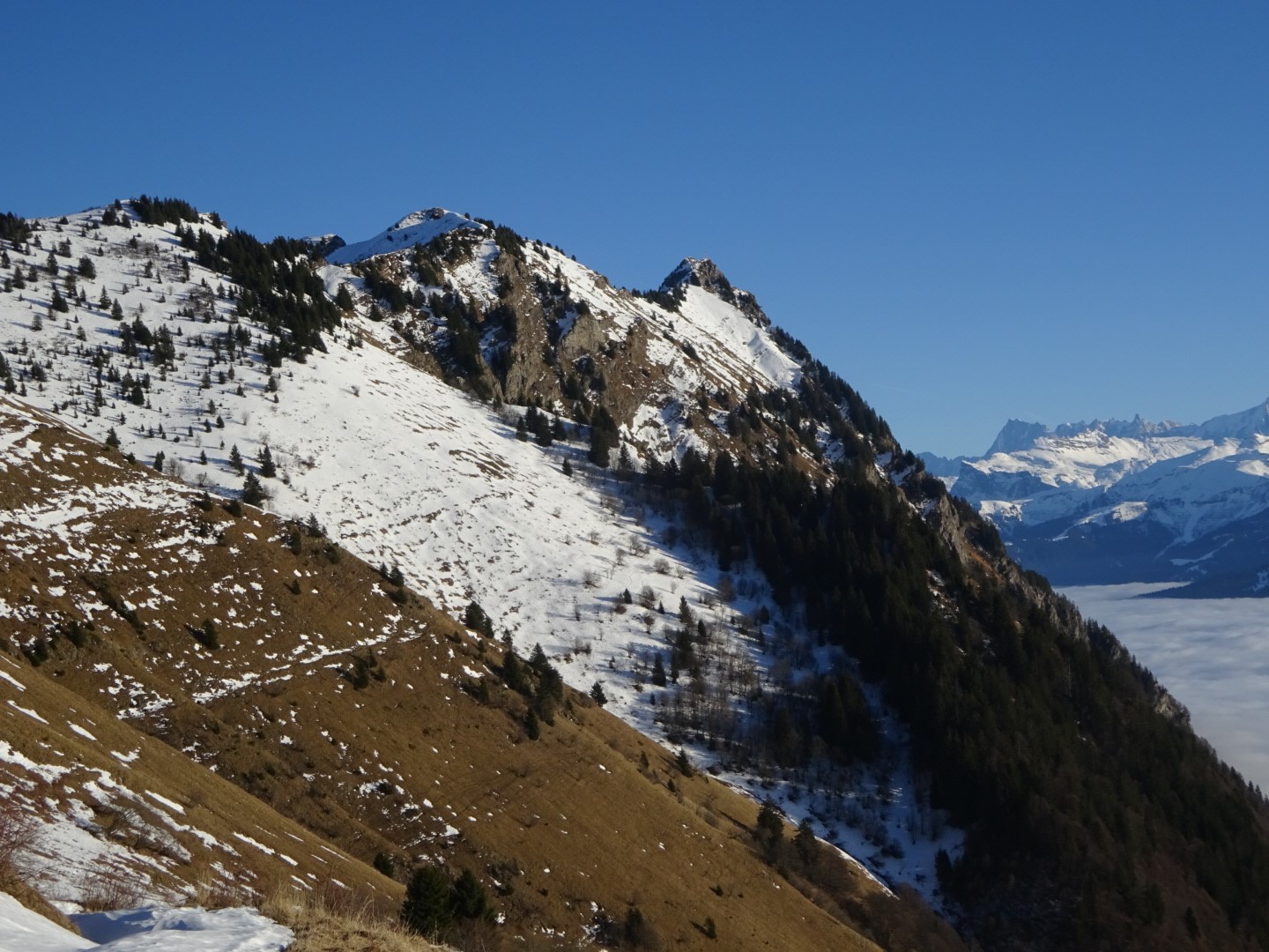 Snow-covered mountains under a clear blue sky HD Wallpaper