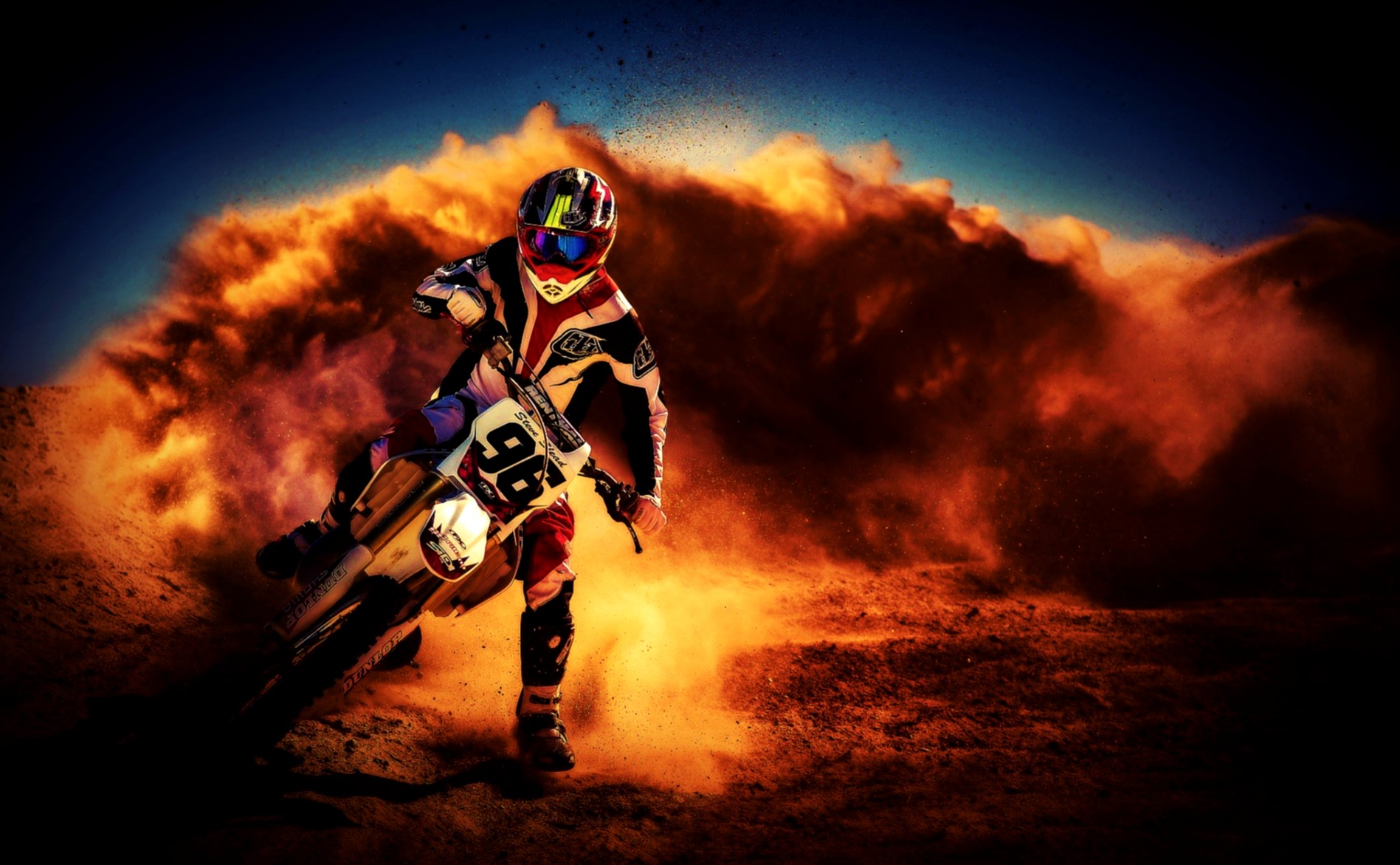 Motocross rider kicking up dust in the desert HD Wallpaper