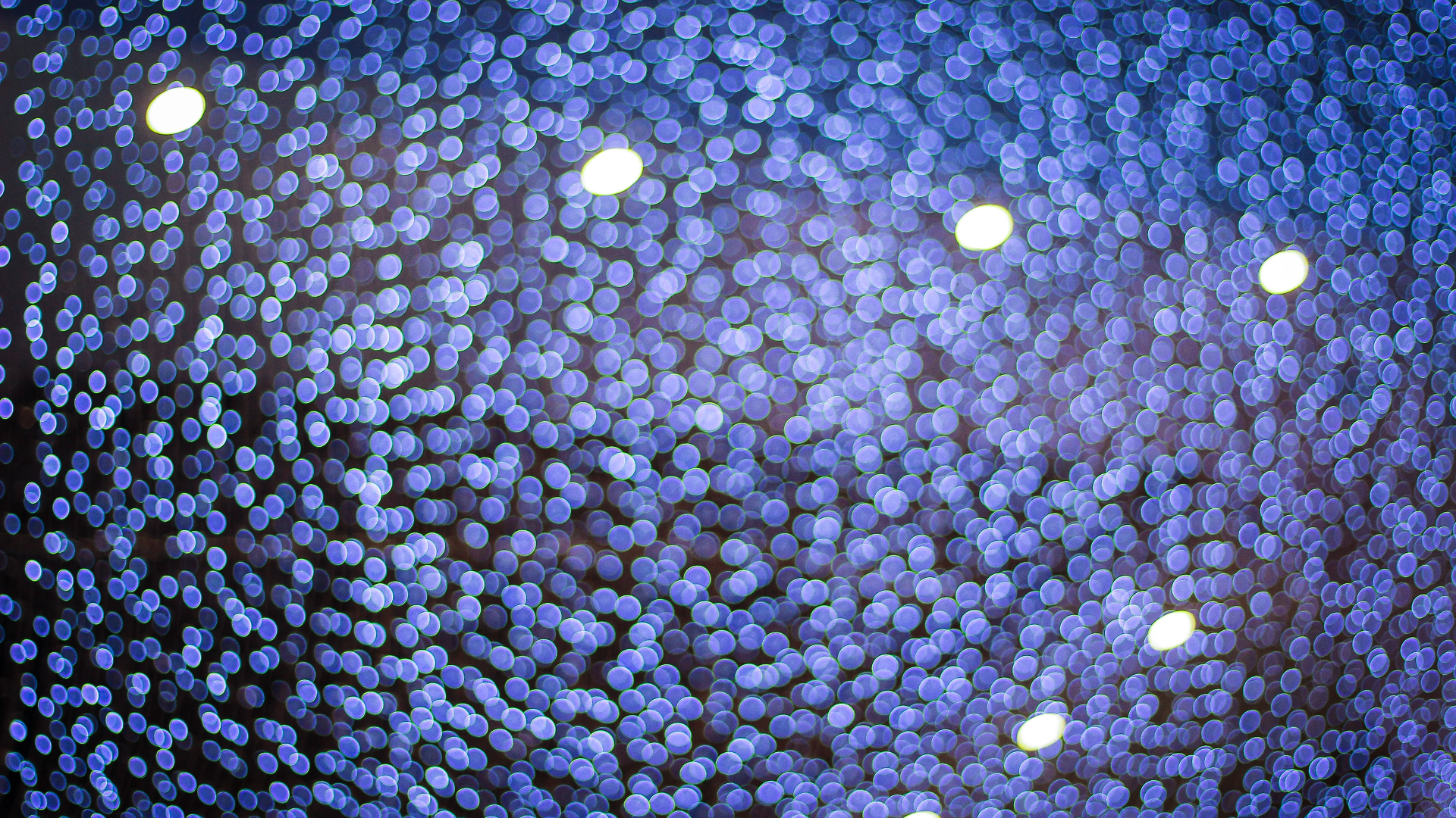 Blue bokeh lights with bright spots HD Wallpaper