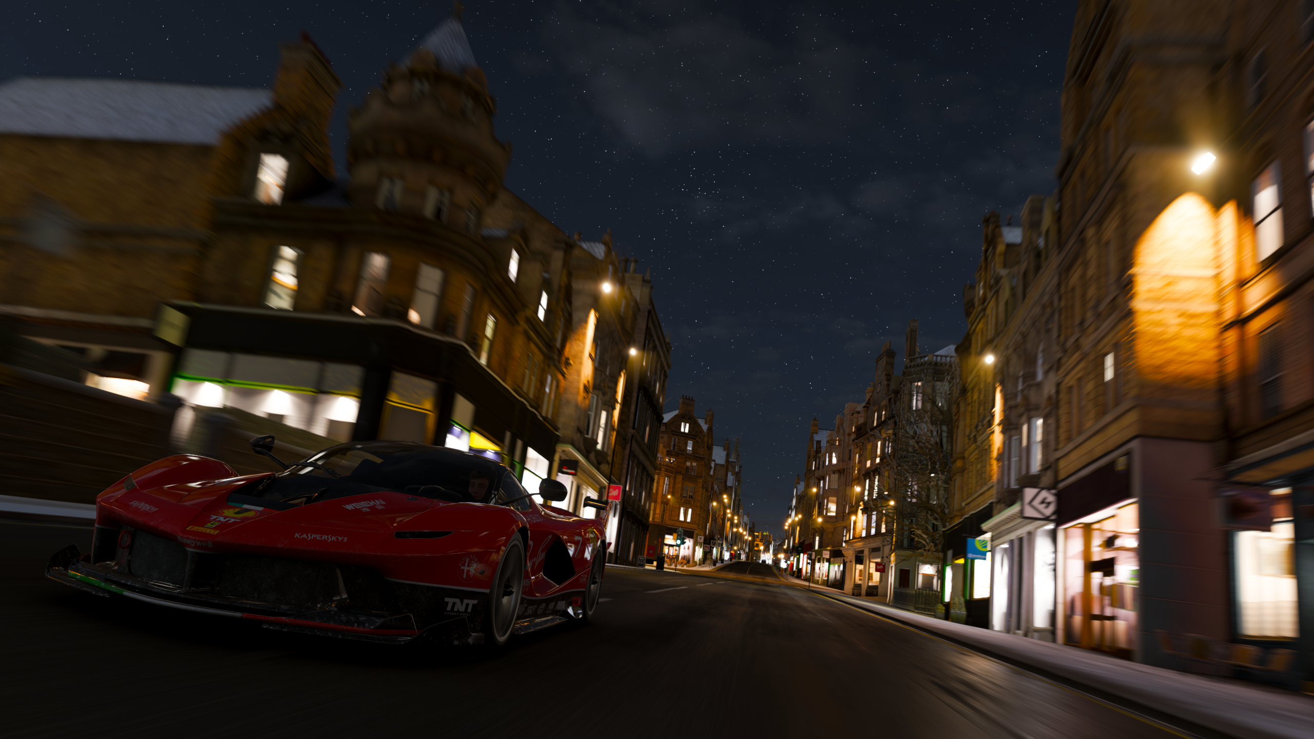 Ferrari driving through Edinburgh at night in Forza Horizon 4 HD Wallpaper