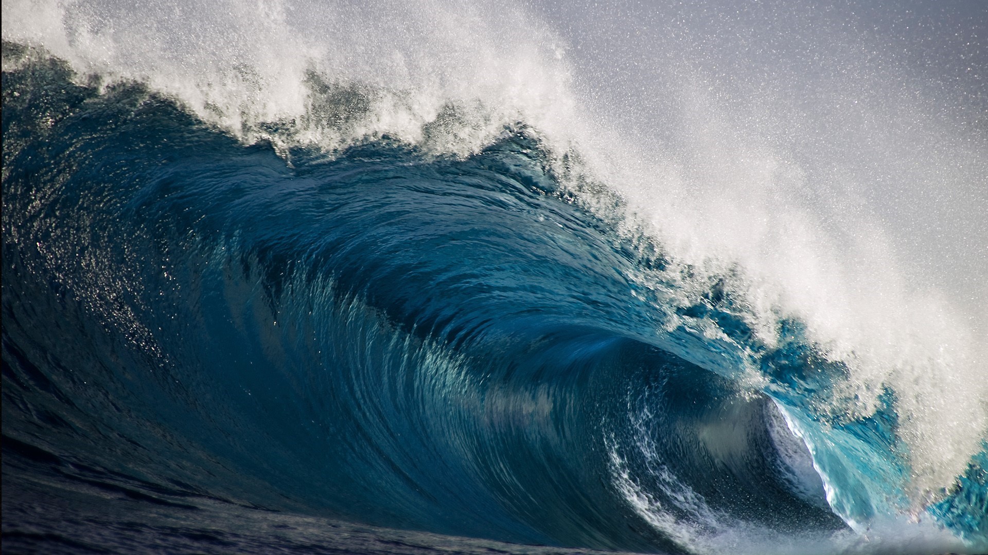 Powerful ocean wave crashing with white foam HD Wallpaper