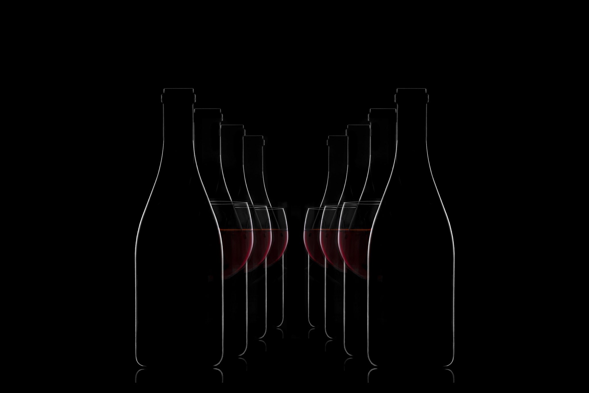 Bottles and glasses of red wine on a black background HD Wallpaper