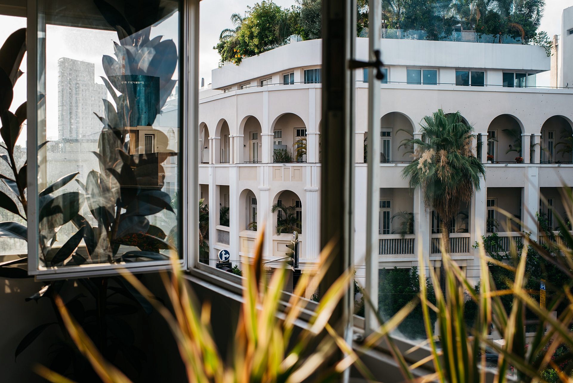 View through window of building in Tel Aviv HD Wallpaper