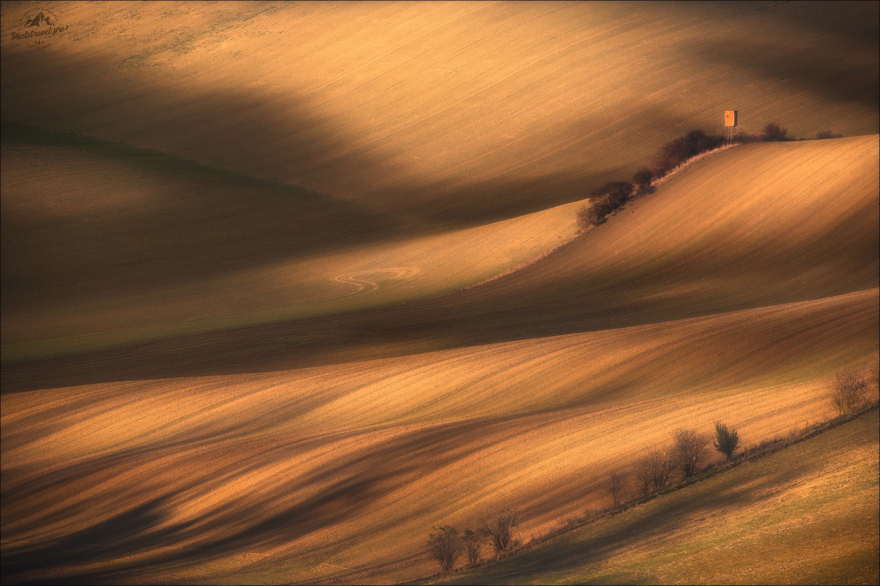 Rolling hills with dramatic shadows and sunlight HD Wallpaper