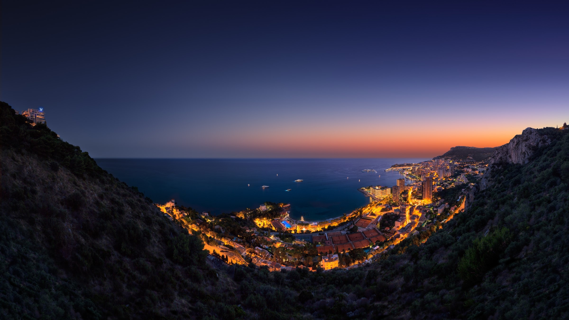 Monaco cityscape at sunset from hills overlooking the sea HD Wallpaper