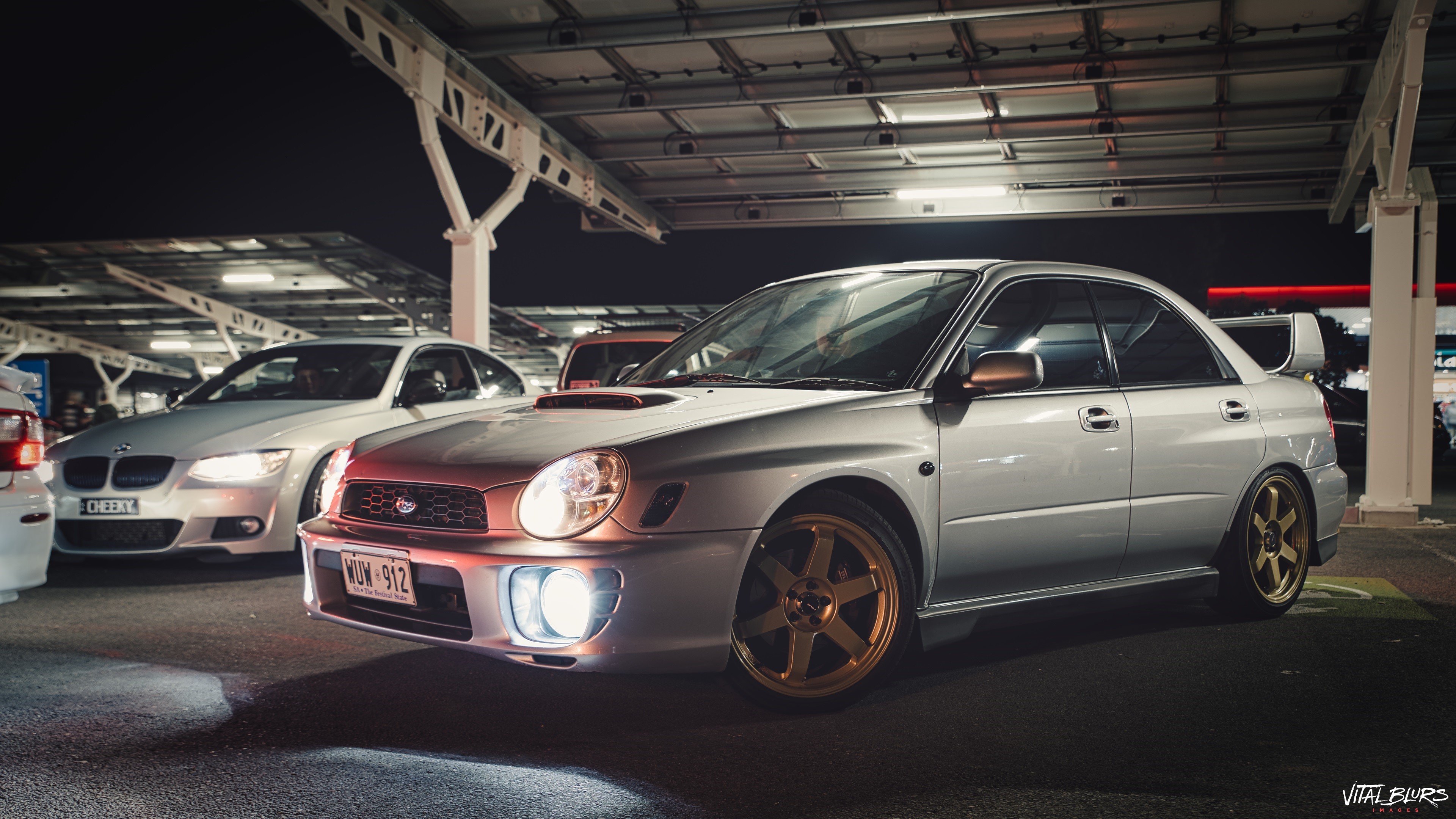 Silver Subaru Impreza WRX STi with gold wheels at night HD Wallpaper
