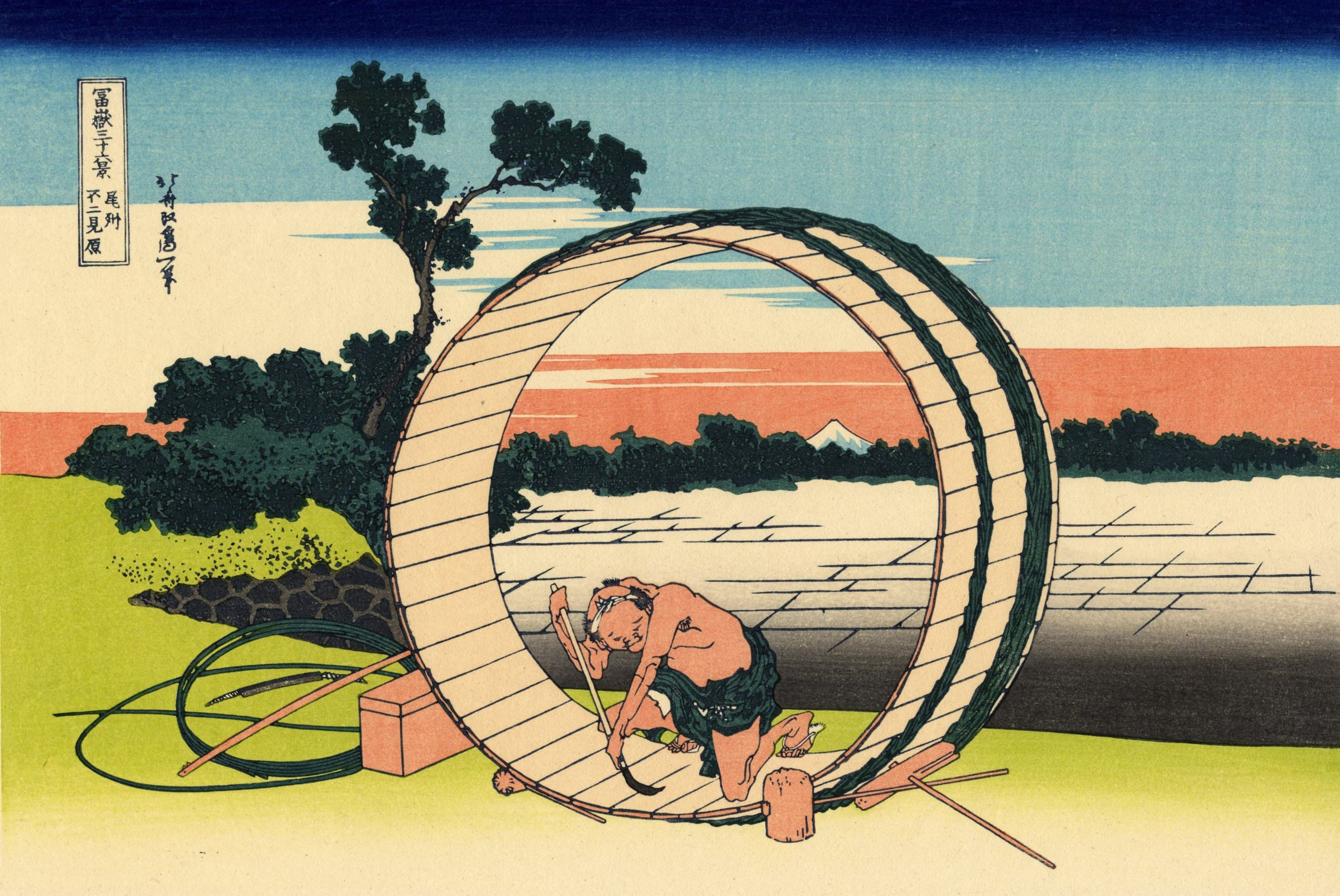 Man Working on Large Wooden Wheel with Mt. Fuji in Background HD Wallpaper
