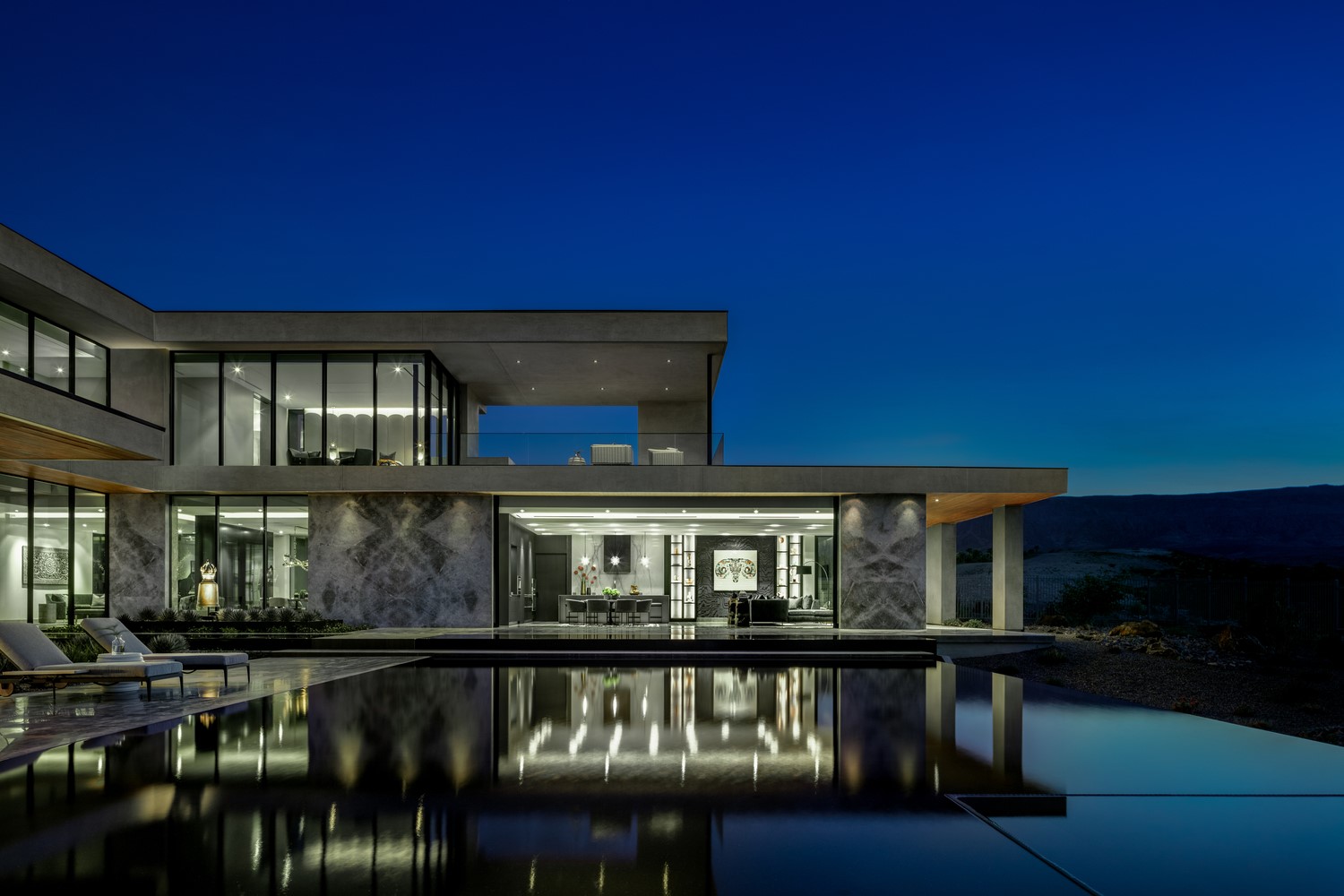 Modern luxury house with infinity pool at dusk HD Wallpaper