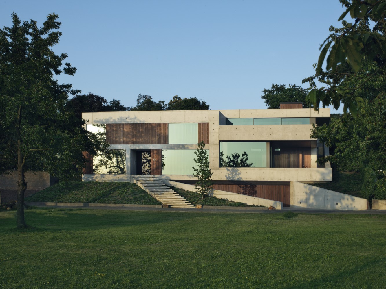Modern concrete and wood house with large windows HD Wallpaper