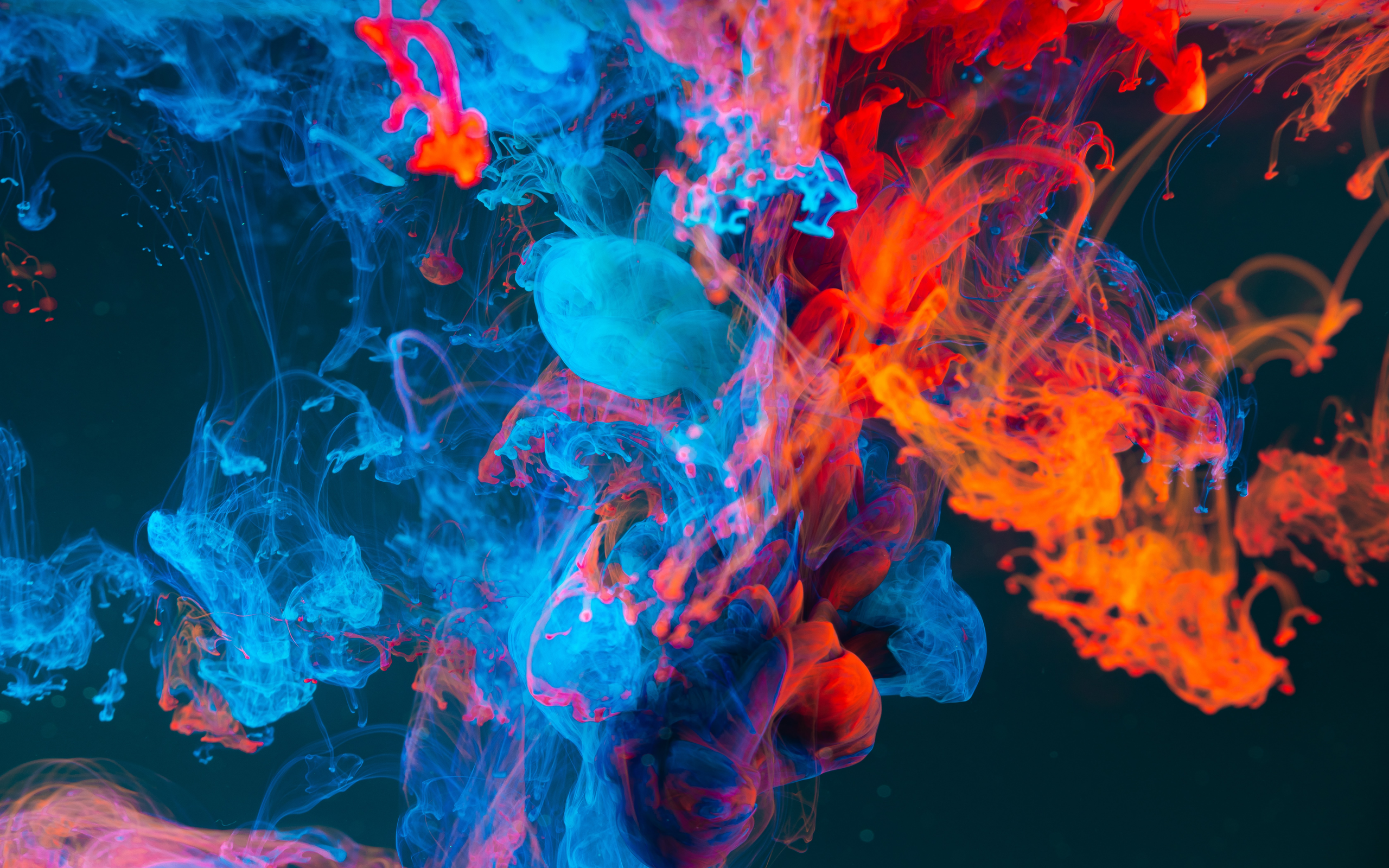 Abstract swirls of blue and red ink in water HD Wallpaper