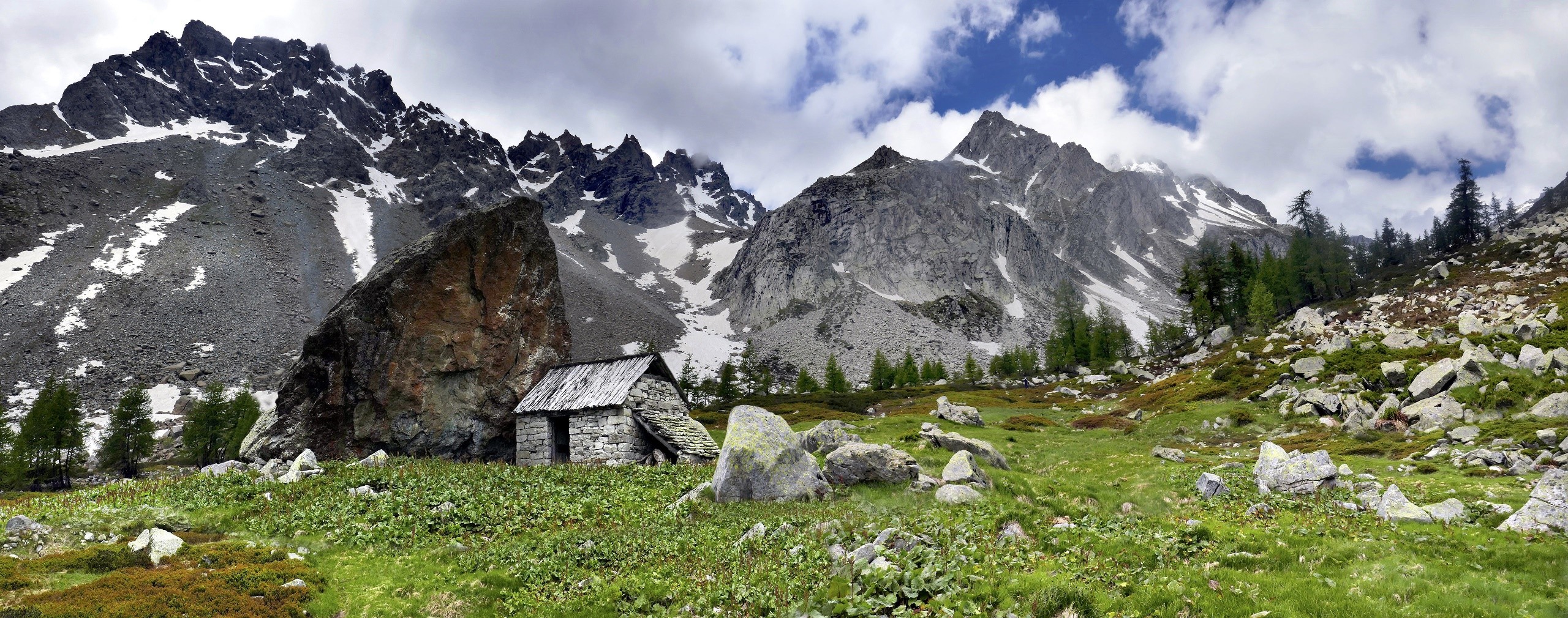 Stone cabin in the Alps with rocky mountains HD Wallpaper