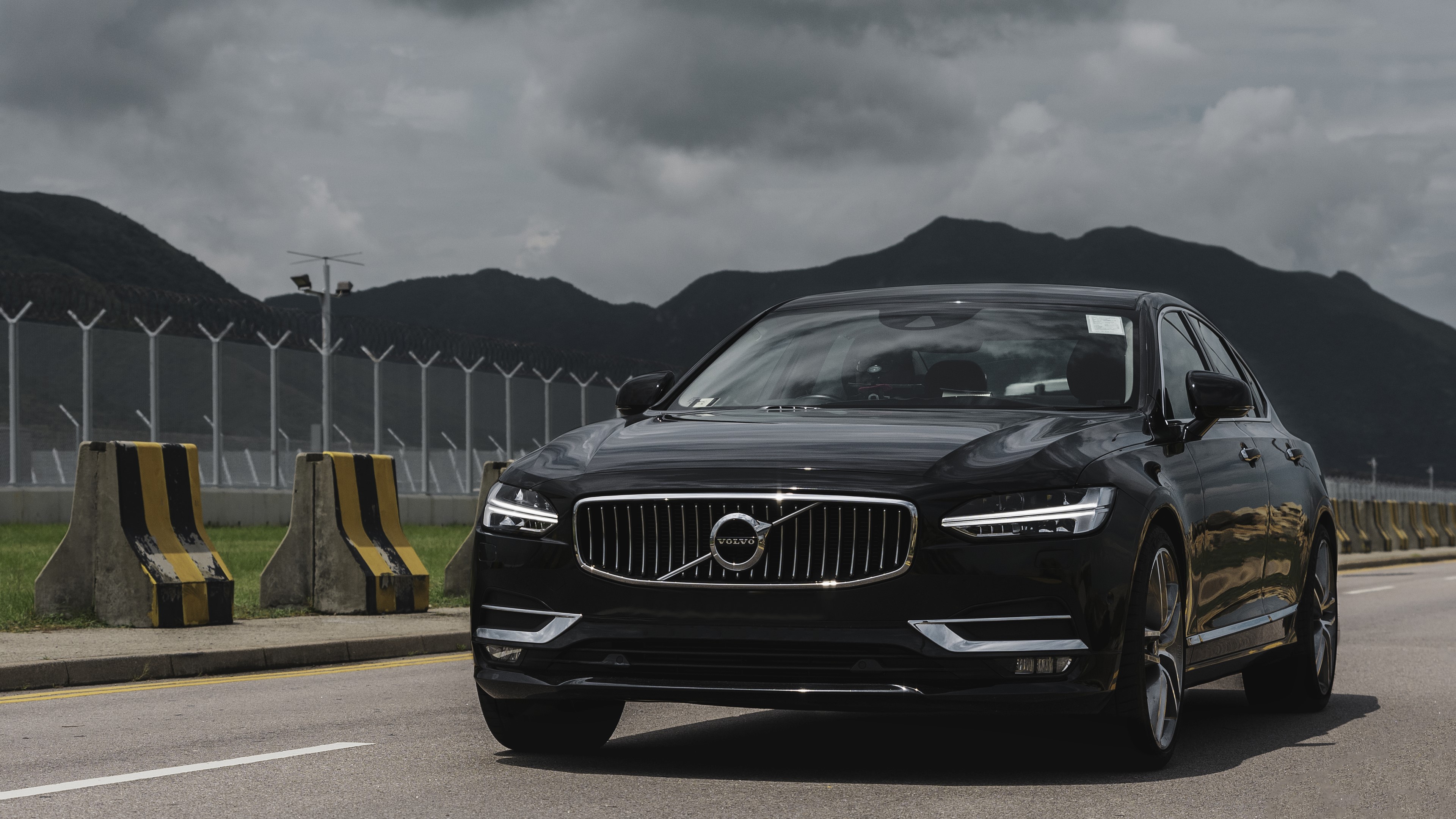 Black Volvo S90 on a road in Hong Kong HD Wallpaper