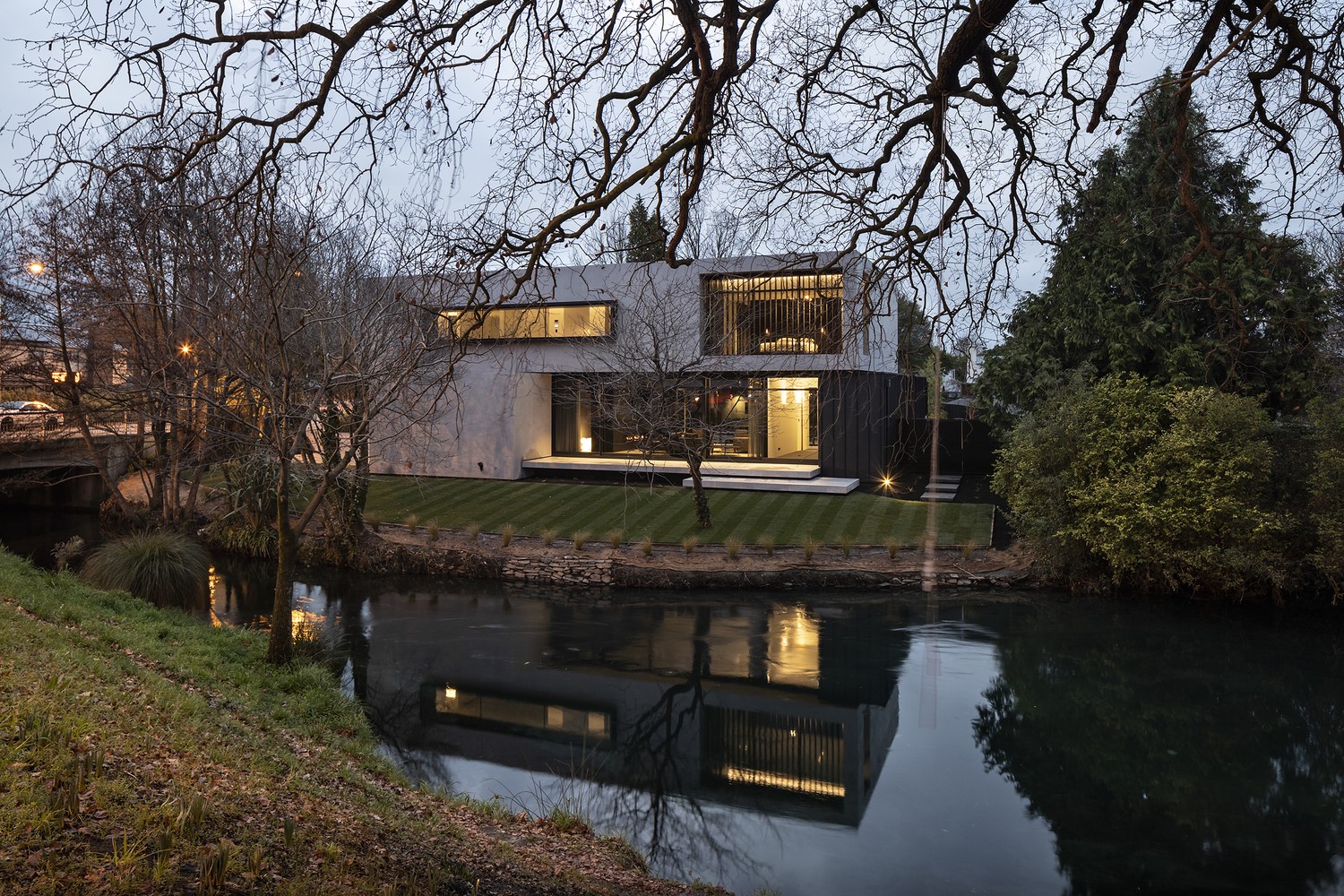 Modern house on a lake at dusk HD Wallpaper