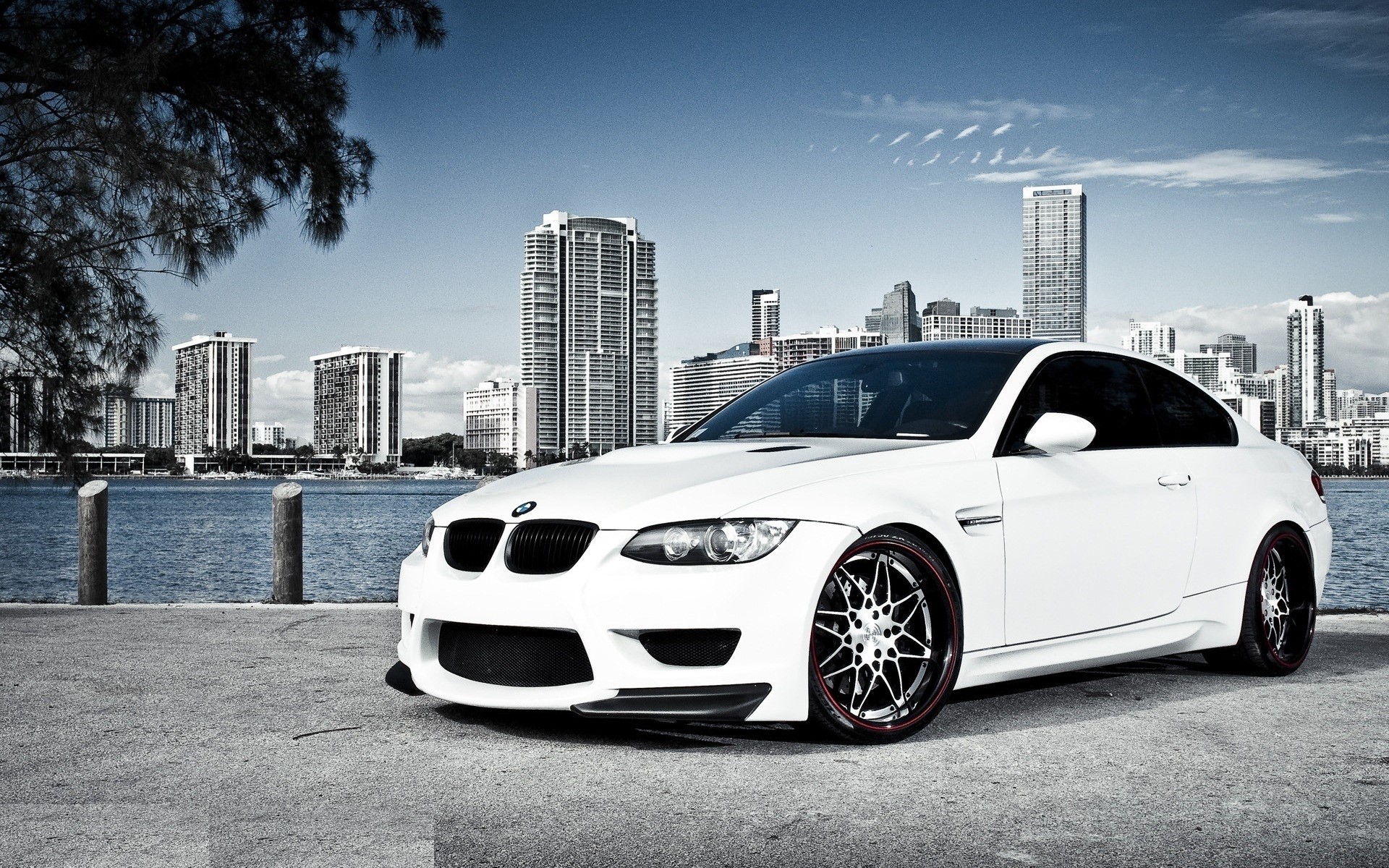 White BMW M3 Coupe by the Sea with City Skyline HD Wallpaper