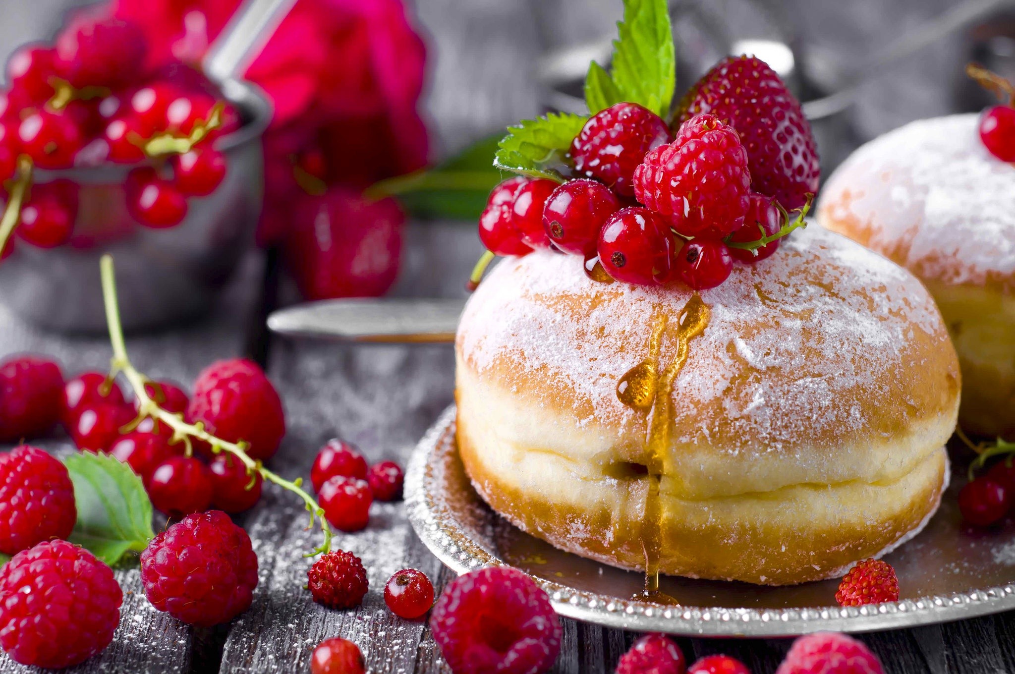 Donut with berries and honey on a wooden table HD Wallpaper