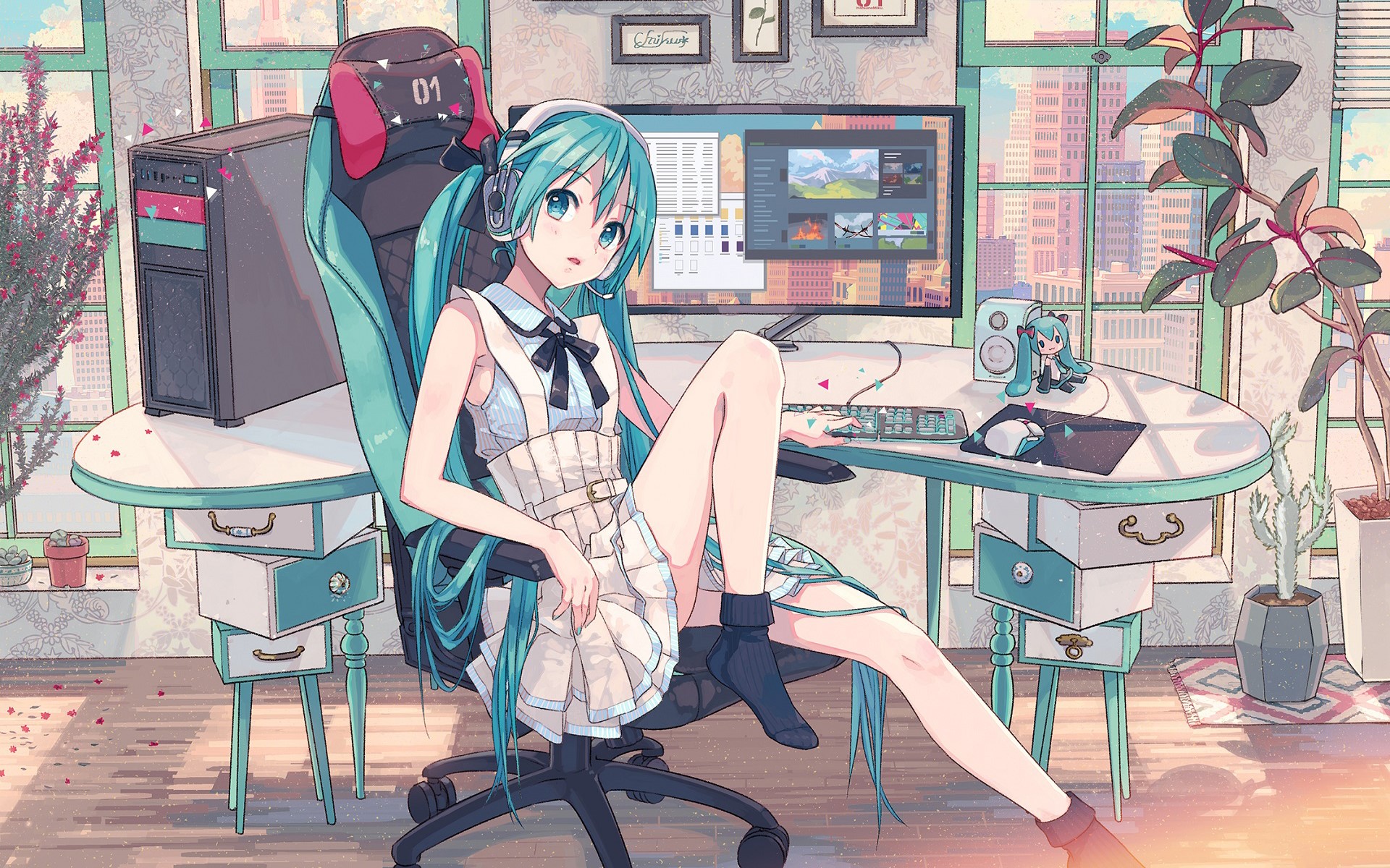Hatsune Miku sitting at a computer desk HD Wallpaper