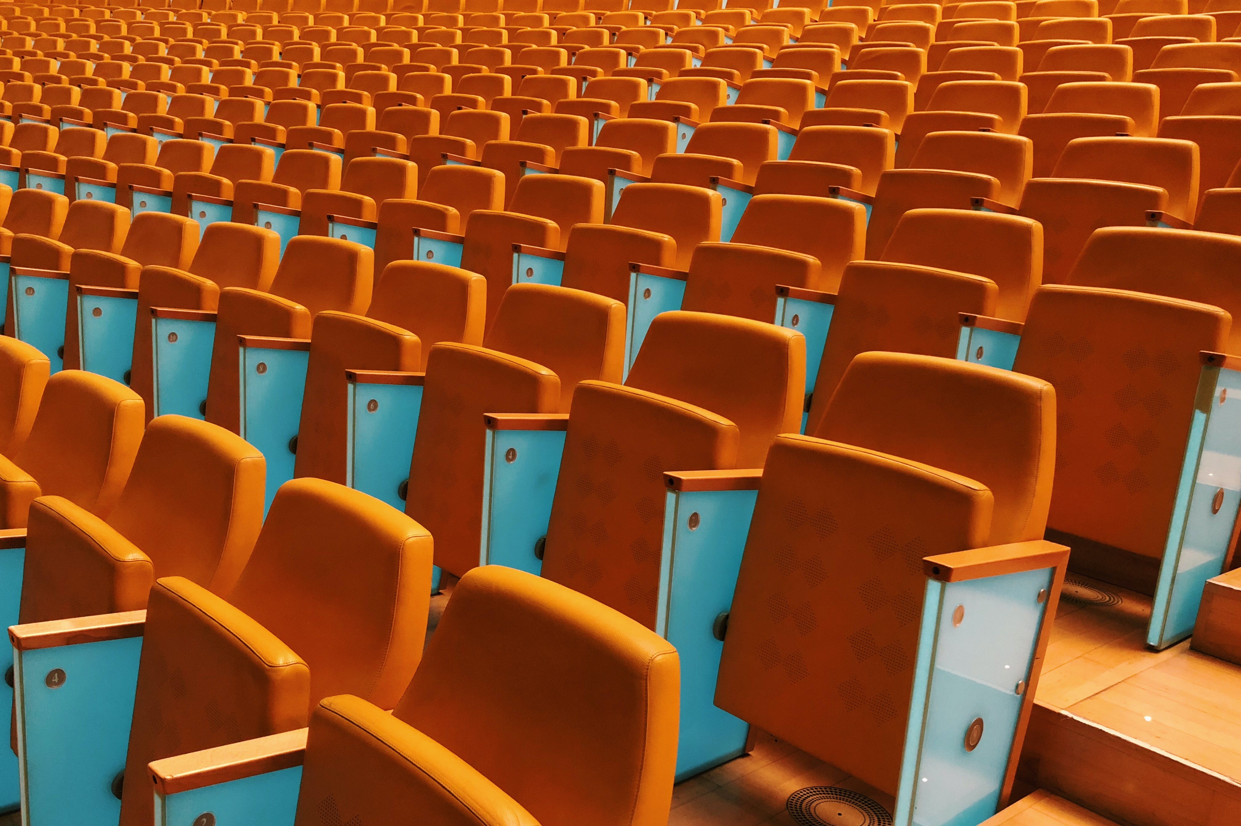Stadium seating with orange sport seats HD Wallpaper