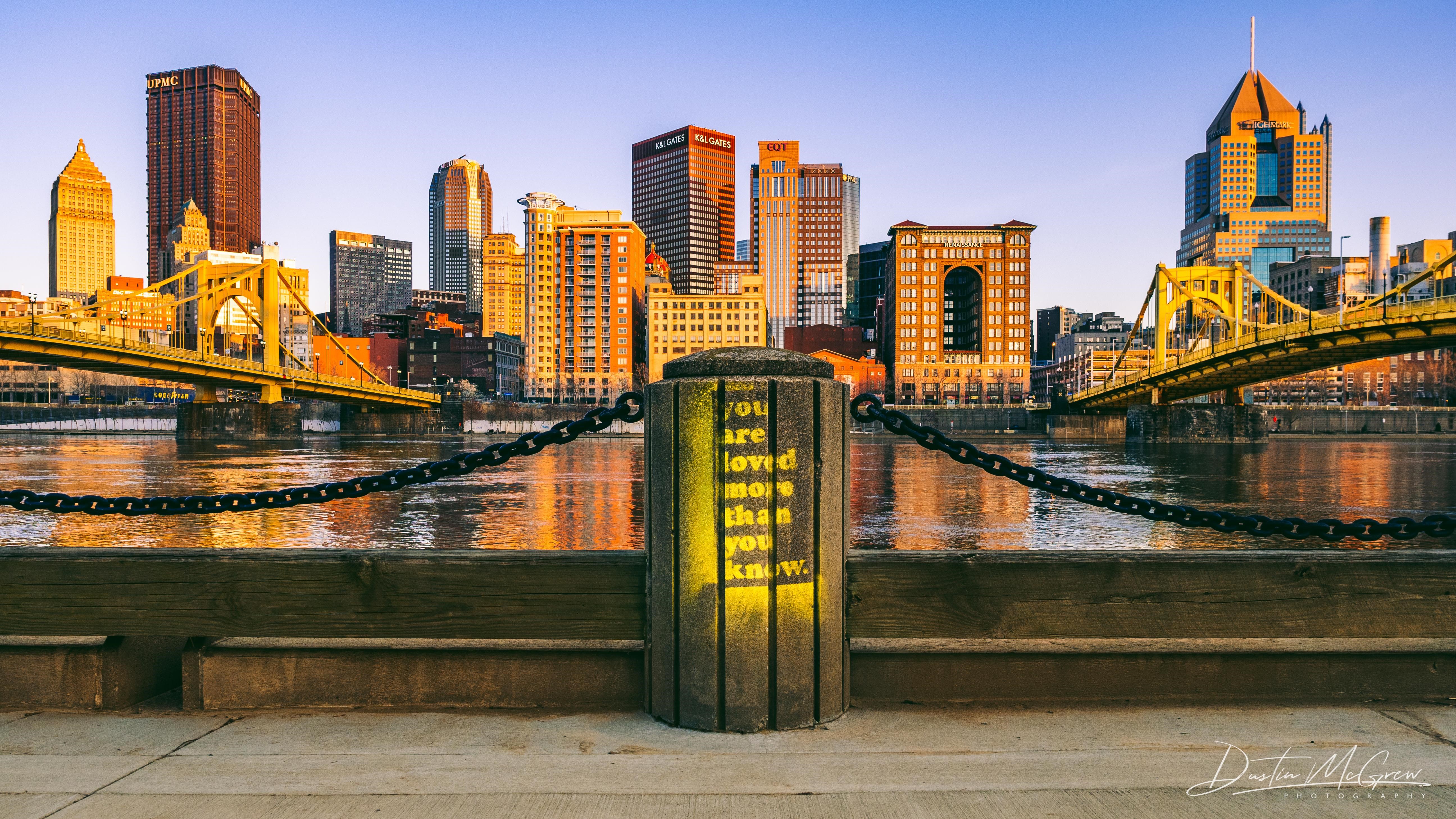 Pittsburgh skyline with yellow bridges and text on post HD Wallpaper