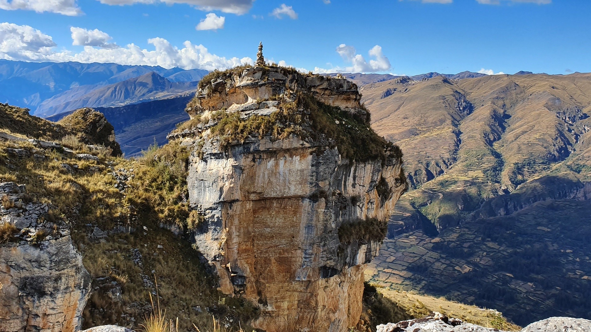Rocky mountain peak with cairn in Peru HD Wallpaper