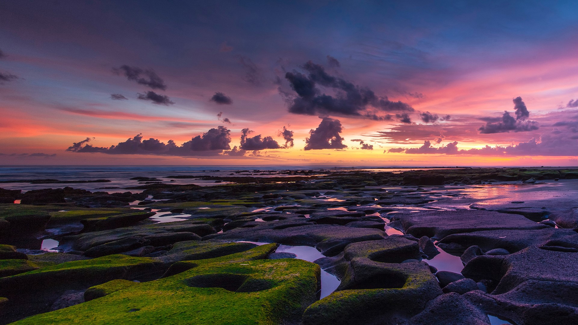 Sunset over rocky coastline in Bali, Indonesia HD Wallpaper