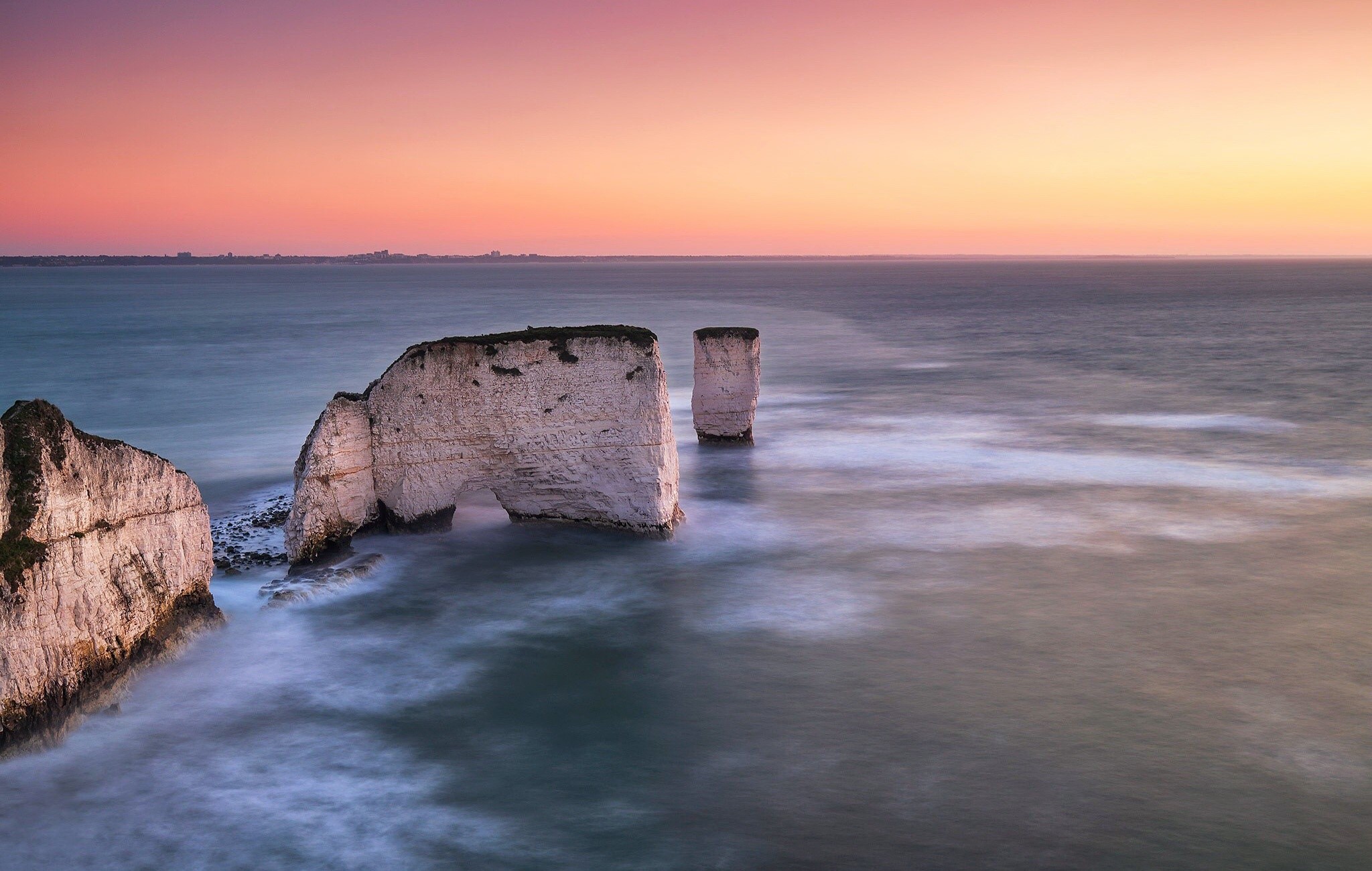 Sea stacks and arch at sunrise, Dorset, England HD Wallpaper