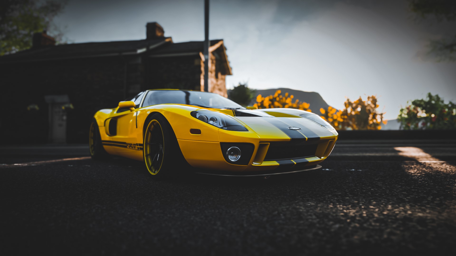Yellow Ford GT with black stripes HD Wallpaper