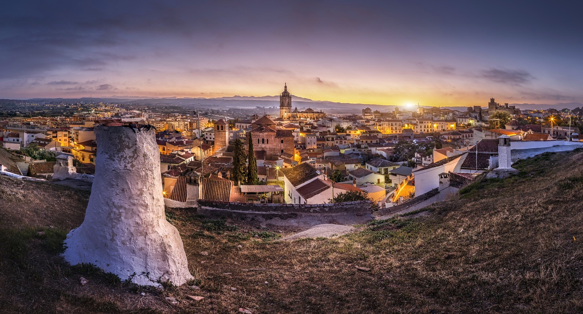 Panoramic view of a Spanish town at sunset HD Wallpaper