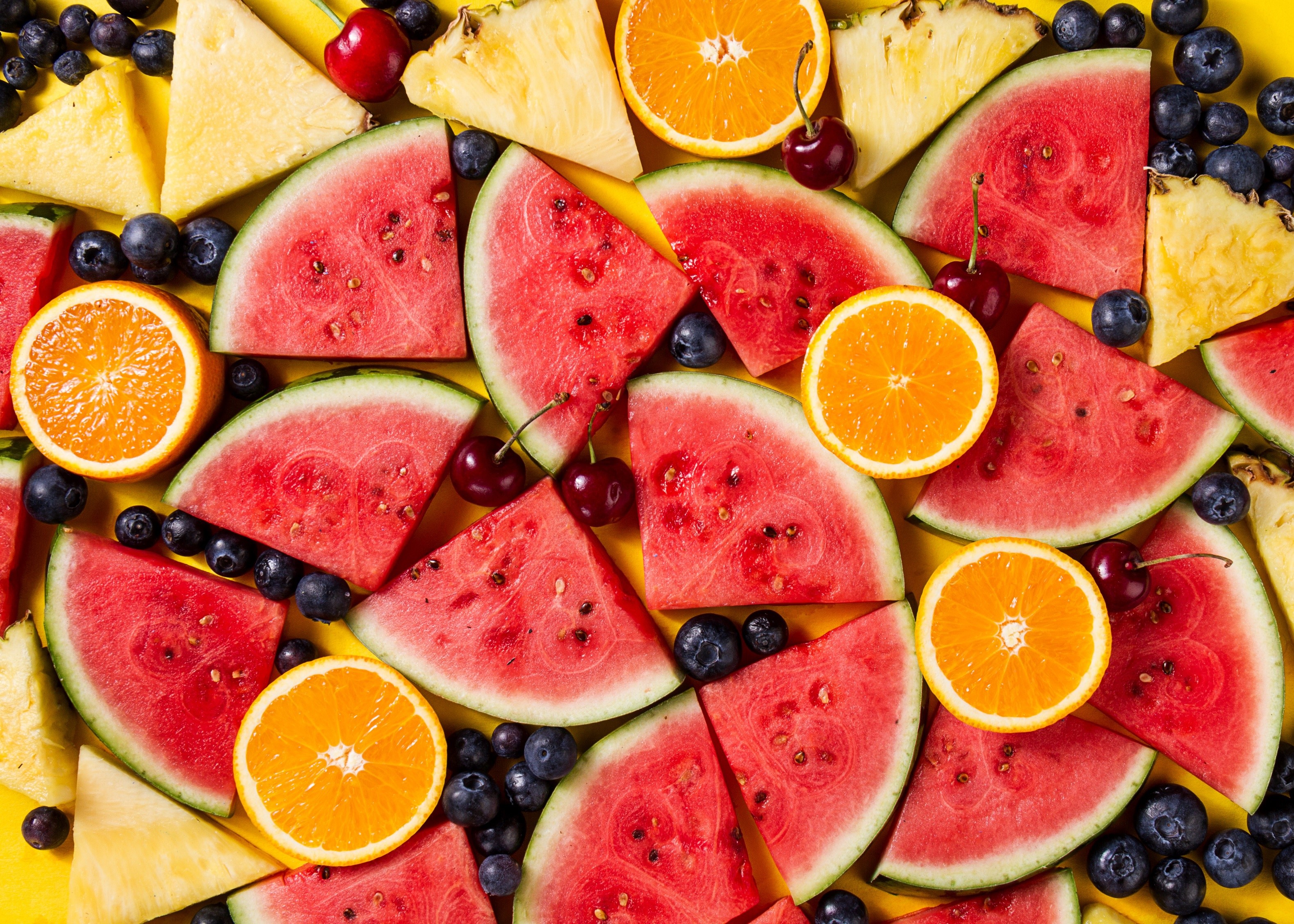 Assortment of fresh fruits including watermelon, oranges, and blueberries HD Wallpaper
