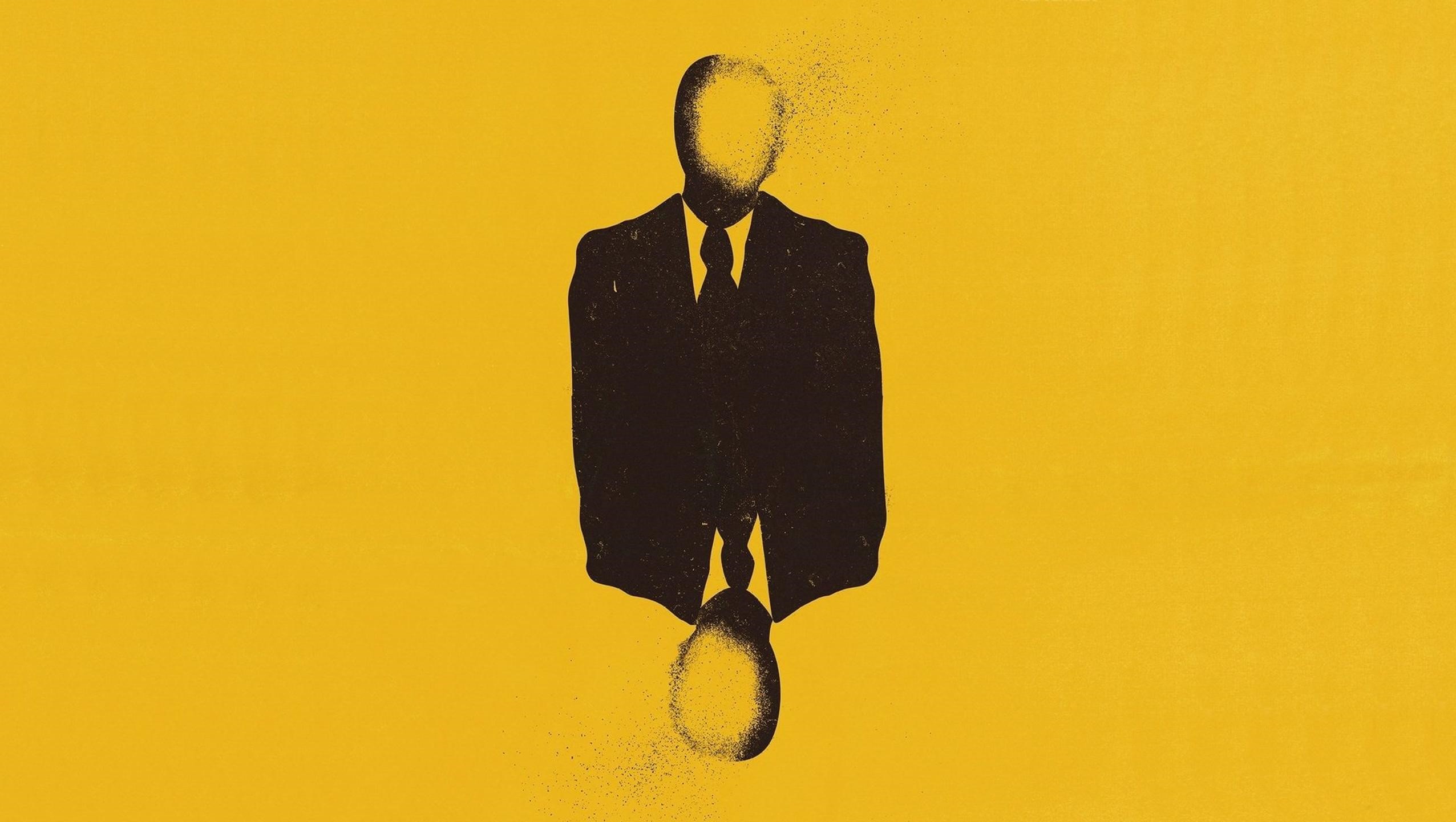 Silhouette of a man in a suit dissolving into particles HD Wallpaper