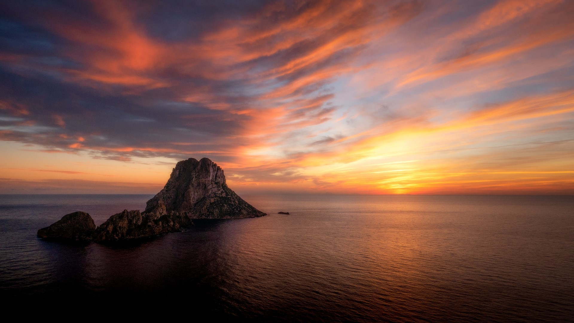 Sunset over the sea with rocks near Ibiza HD Wallpaper