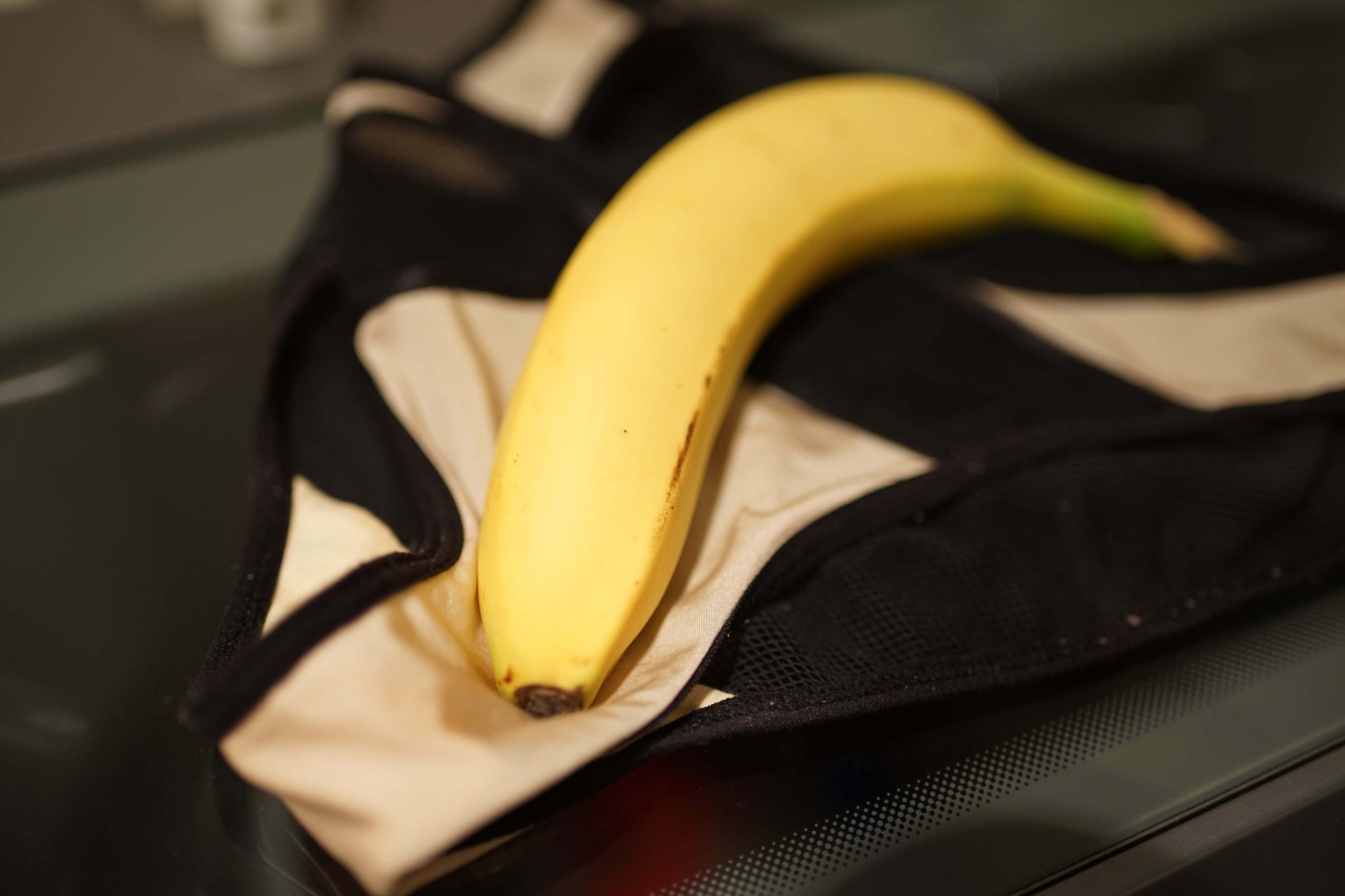 Banana on a black and white bag HD Wallpaper
