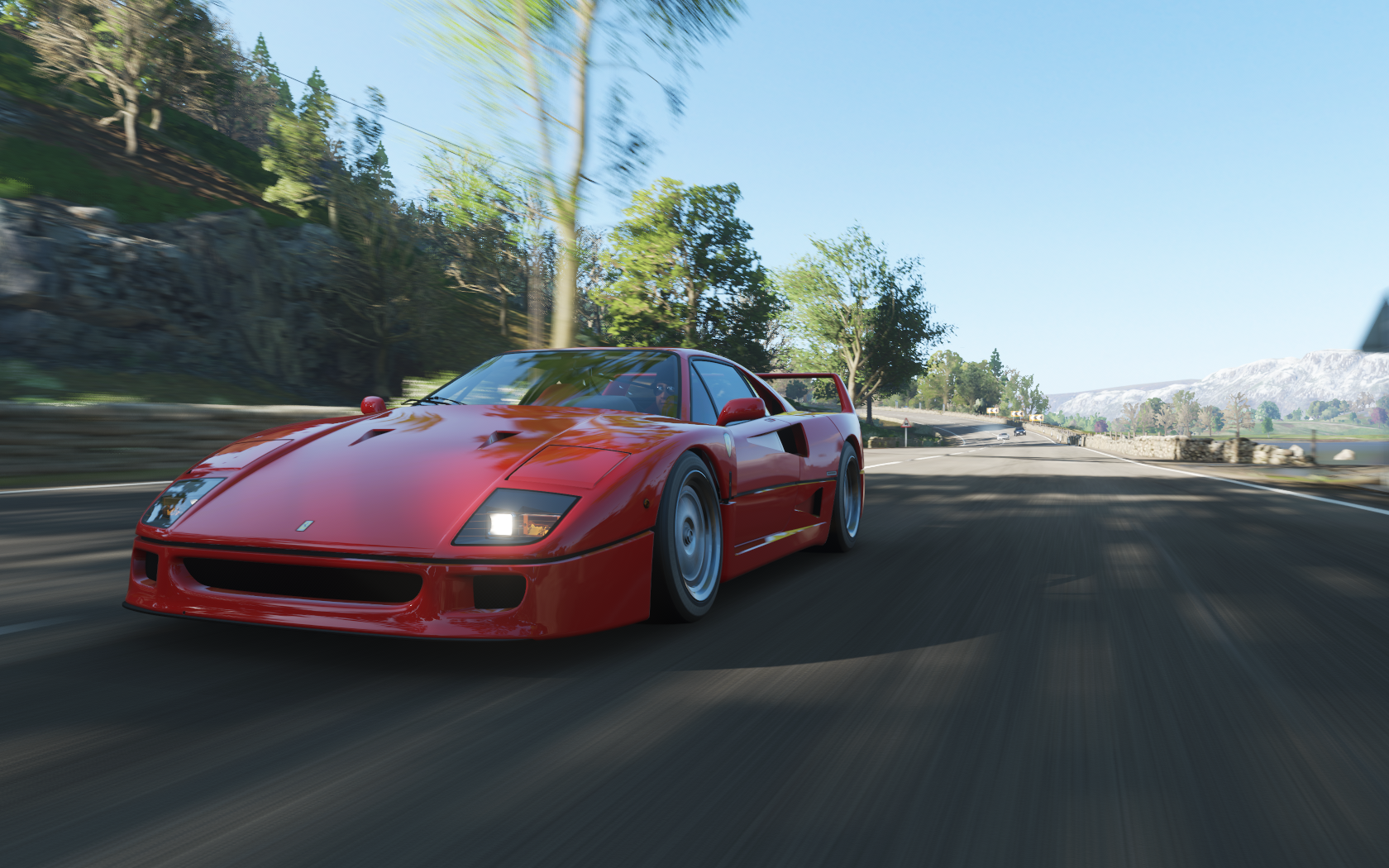 Red Ferrari F40 driving on a road in Forza Horizon 4 HD Wallpaper